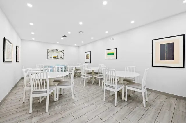 a living room with furniture fireplace and window