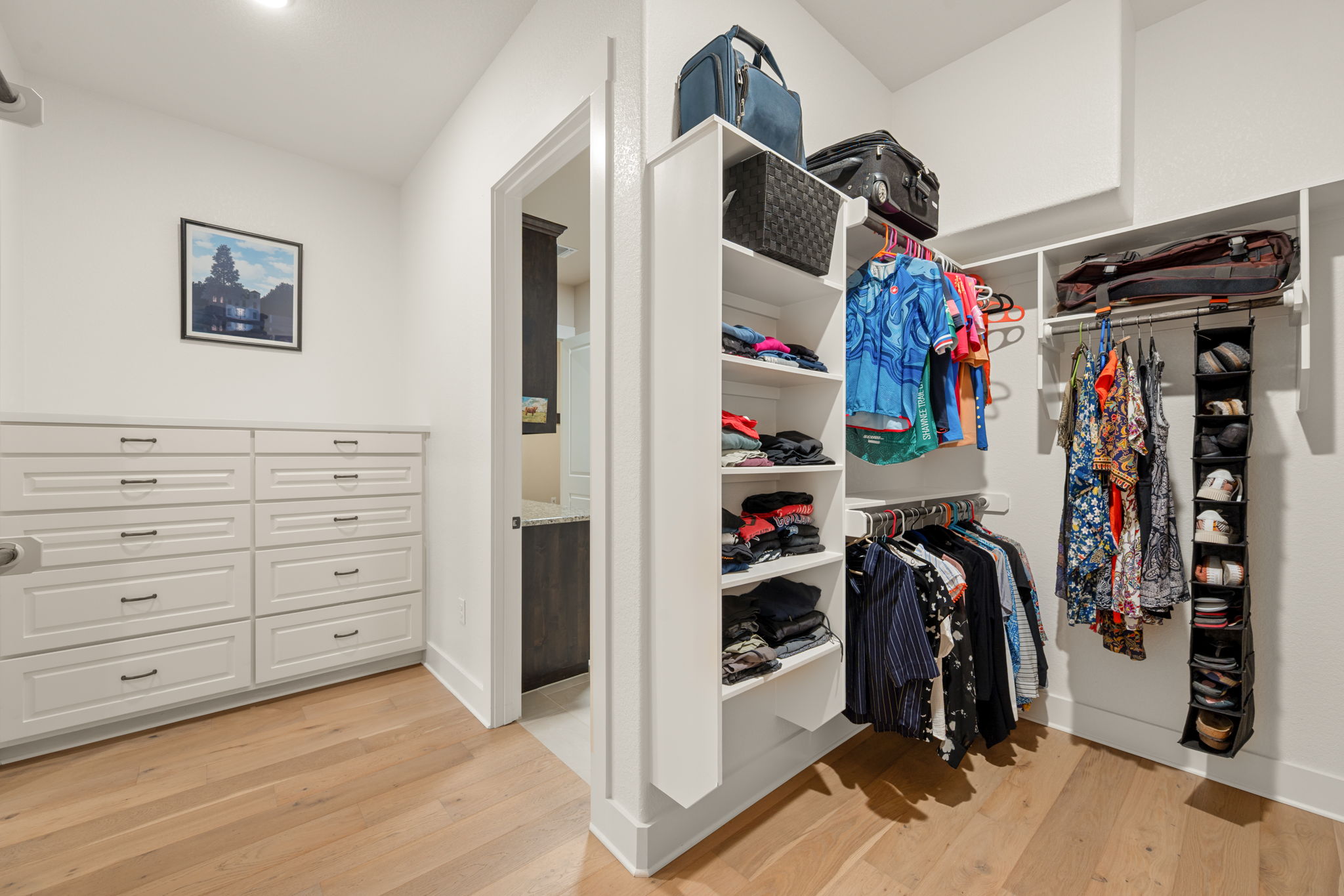 212 Marbella Way Georgetown, TX 78633 - Photo 22 of 40 a view of walk in closet with clothes and shoes