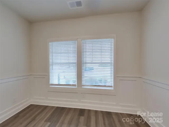 wooden floor and window in an empty room