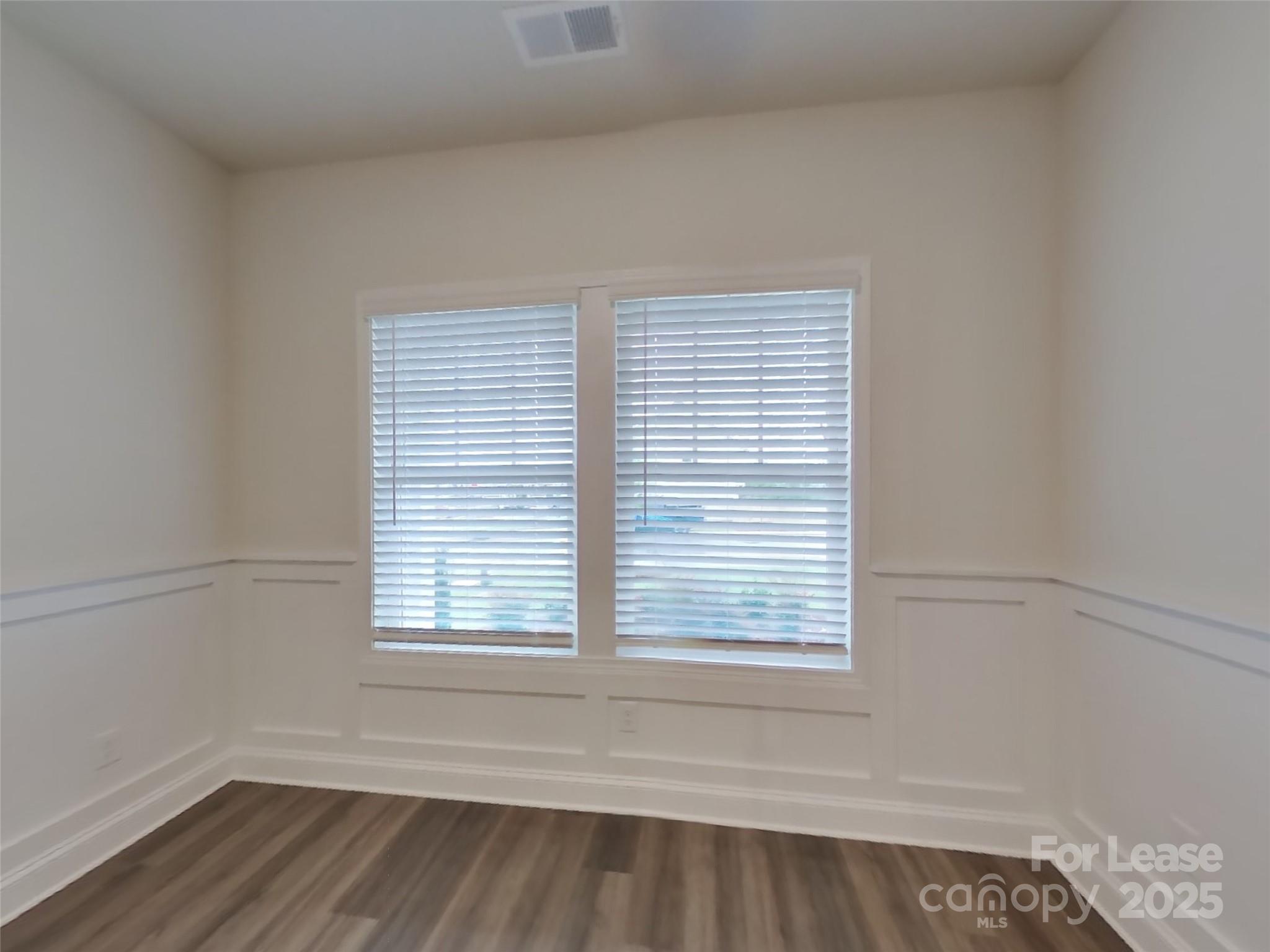 139 Queenshall Road Mooresville, NC 28117 - Photo 17 of 24 wooden floor and window in an empty room