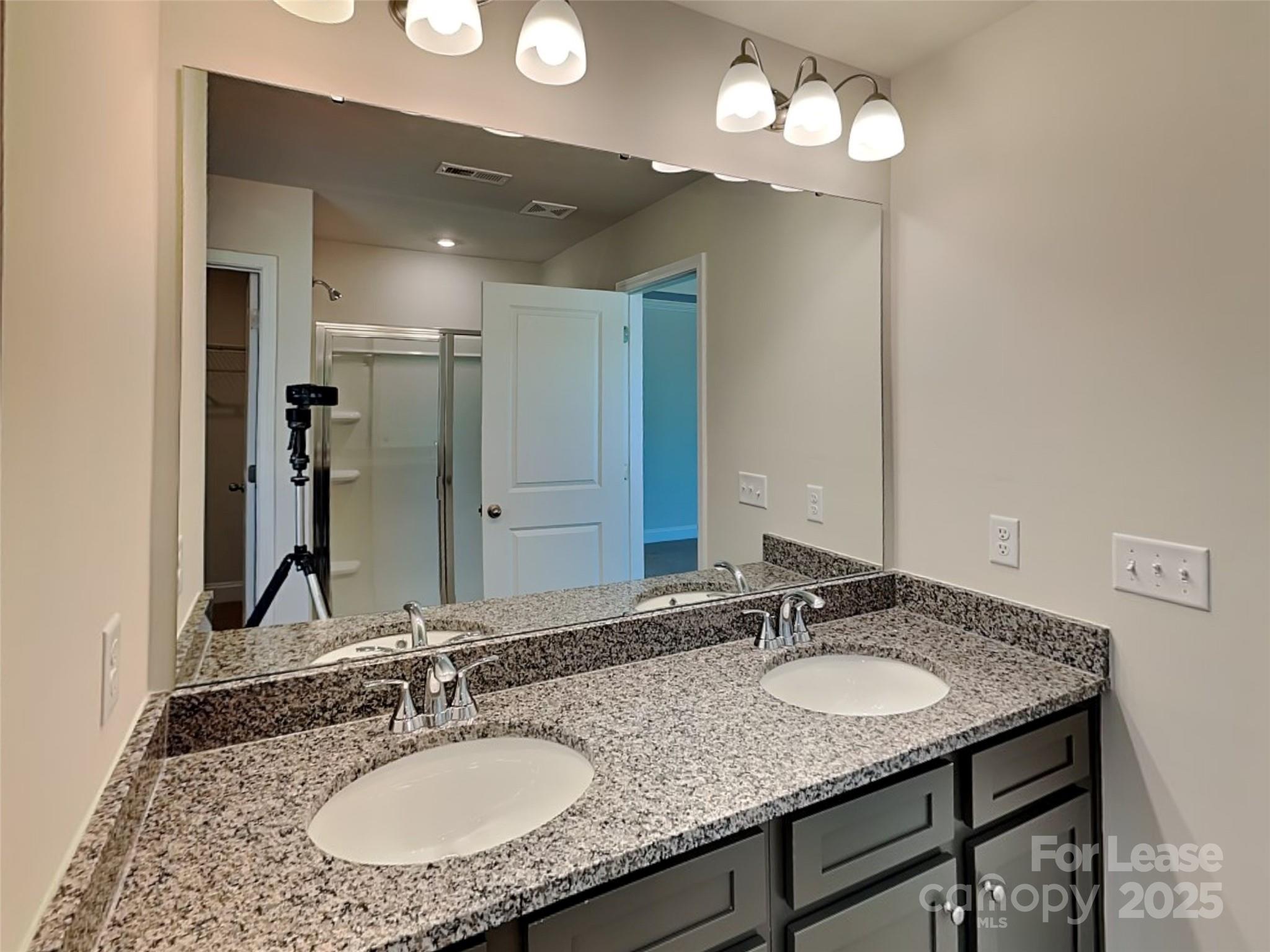 139 Queenshall Road Mooresville, NC 28117 - Photo 22 of 24 a bathroom with a granite countertop sink and a mirror