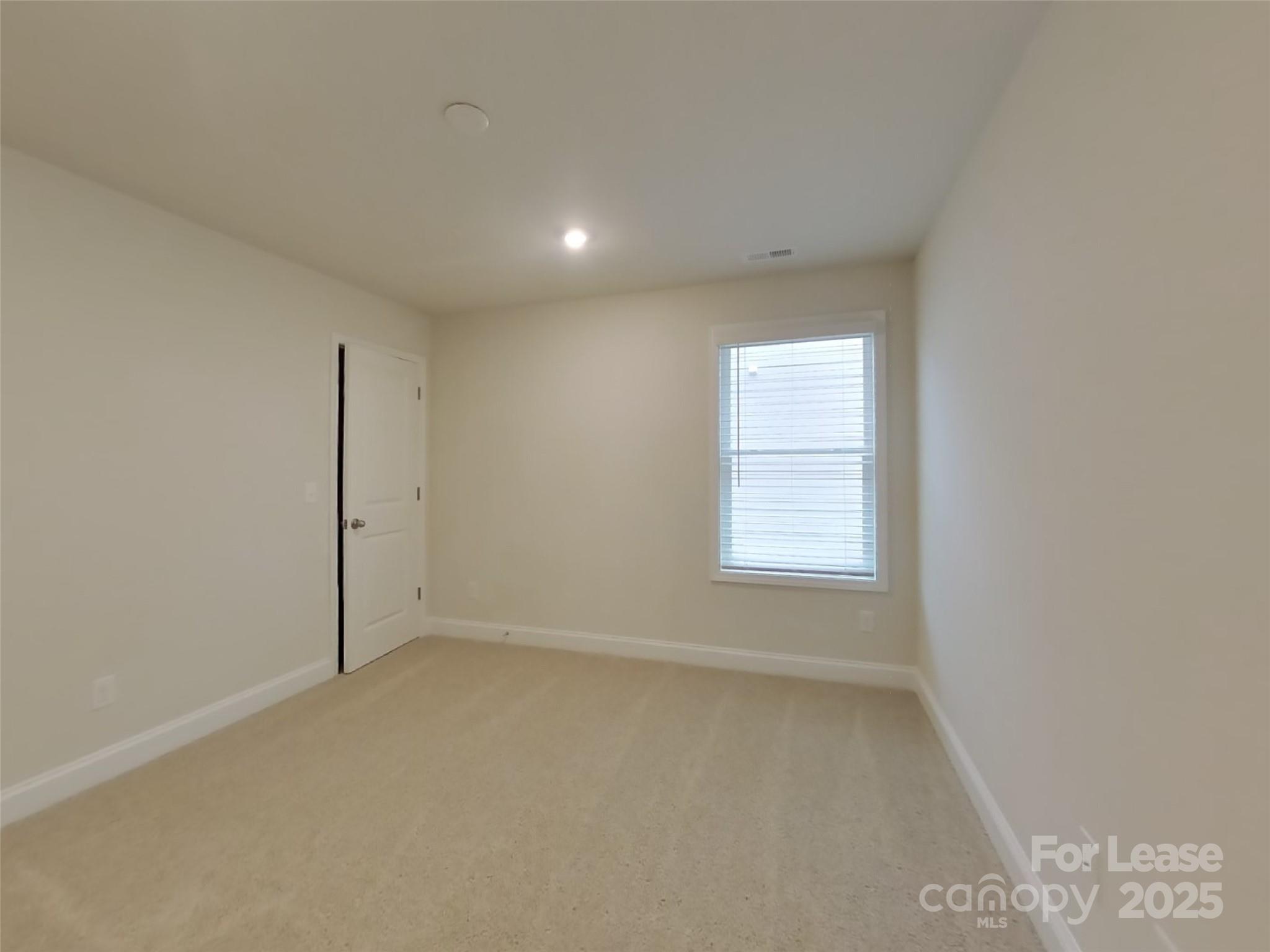 139 Queenshall Road Mooresville, NC 28117 - Photo 23 of 24 an empty room with a window