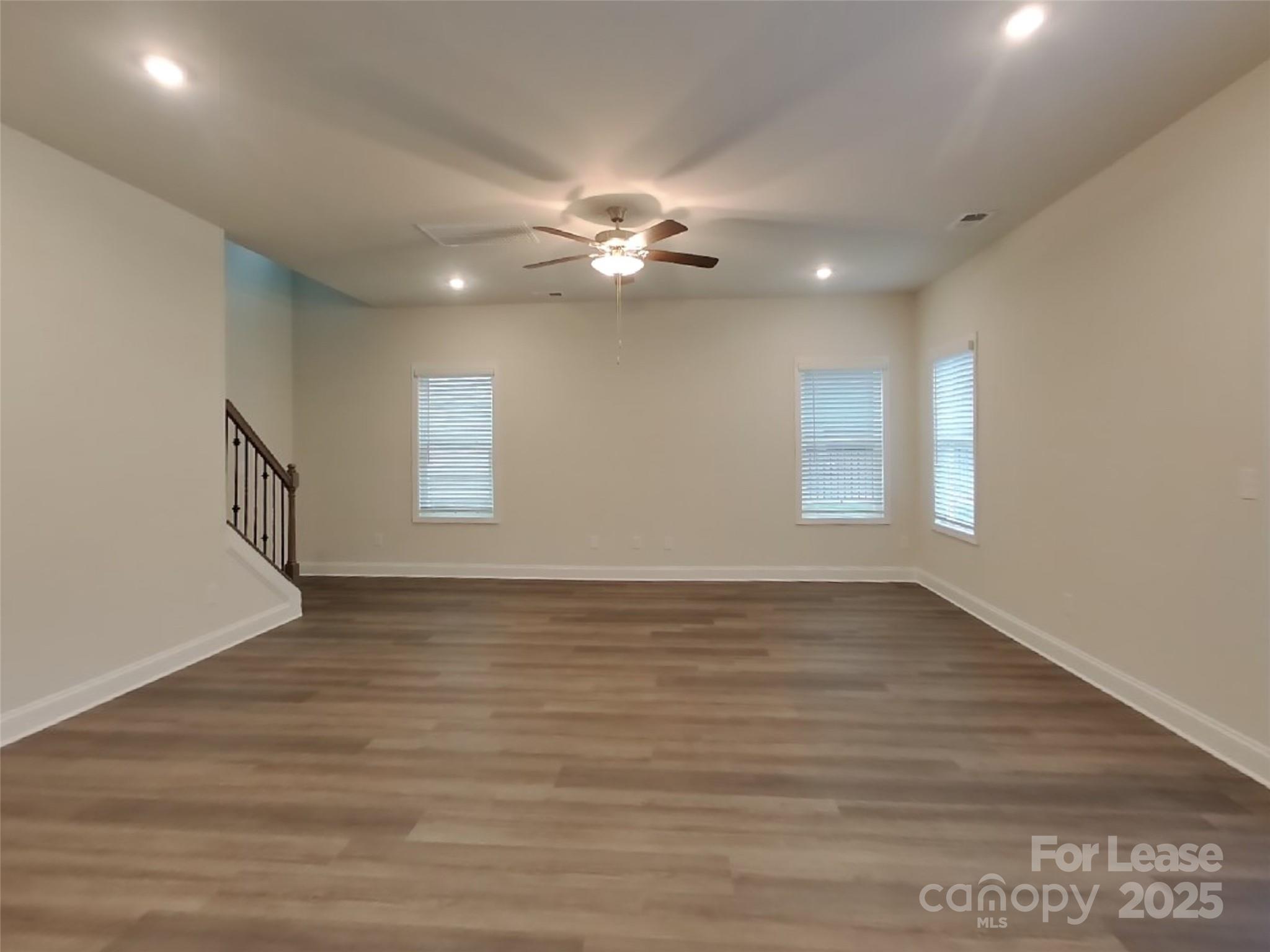 139 Queenshall Road Mooresville, NC 28117 - Photo 5 of 24 wooden floor in an empty room with a window