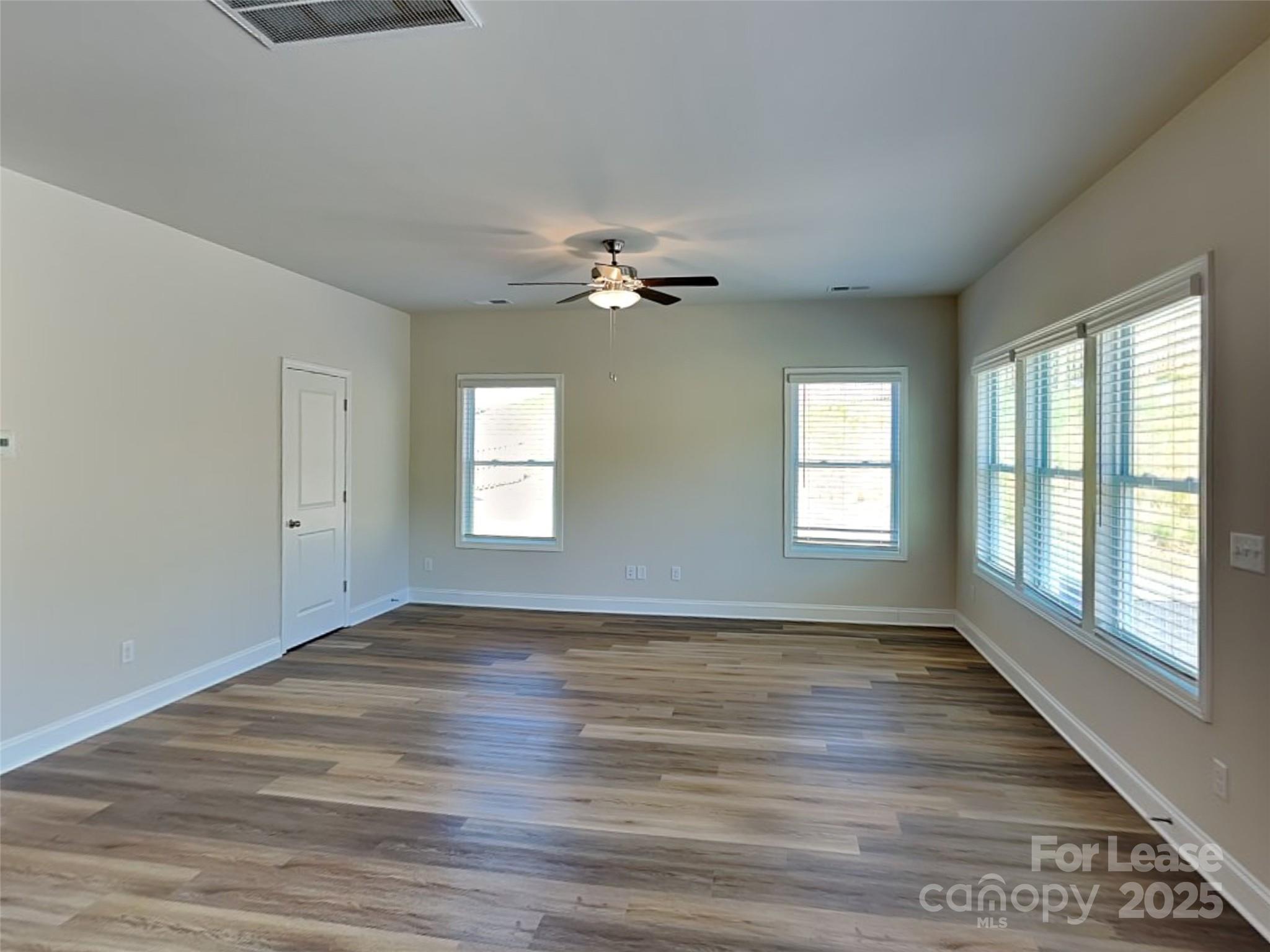 139 Queenshall Road Mooresville, NC 28117 - Photo 7 of 24 wooden floor that has a window in an empty room