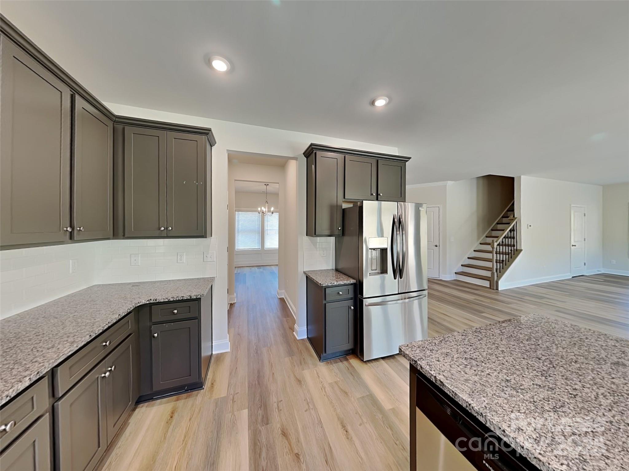 139 Queenshall Road Mooresville, NC 28117 - Photo 9 of 24 a kitchen with a refrigerator and a sink