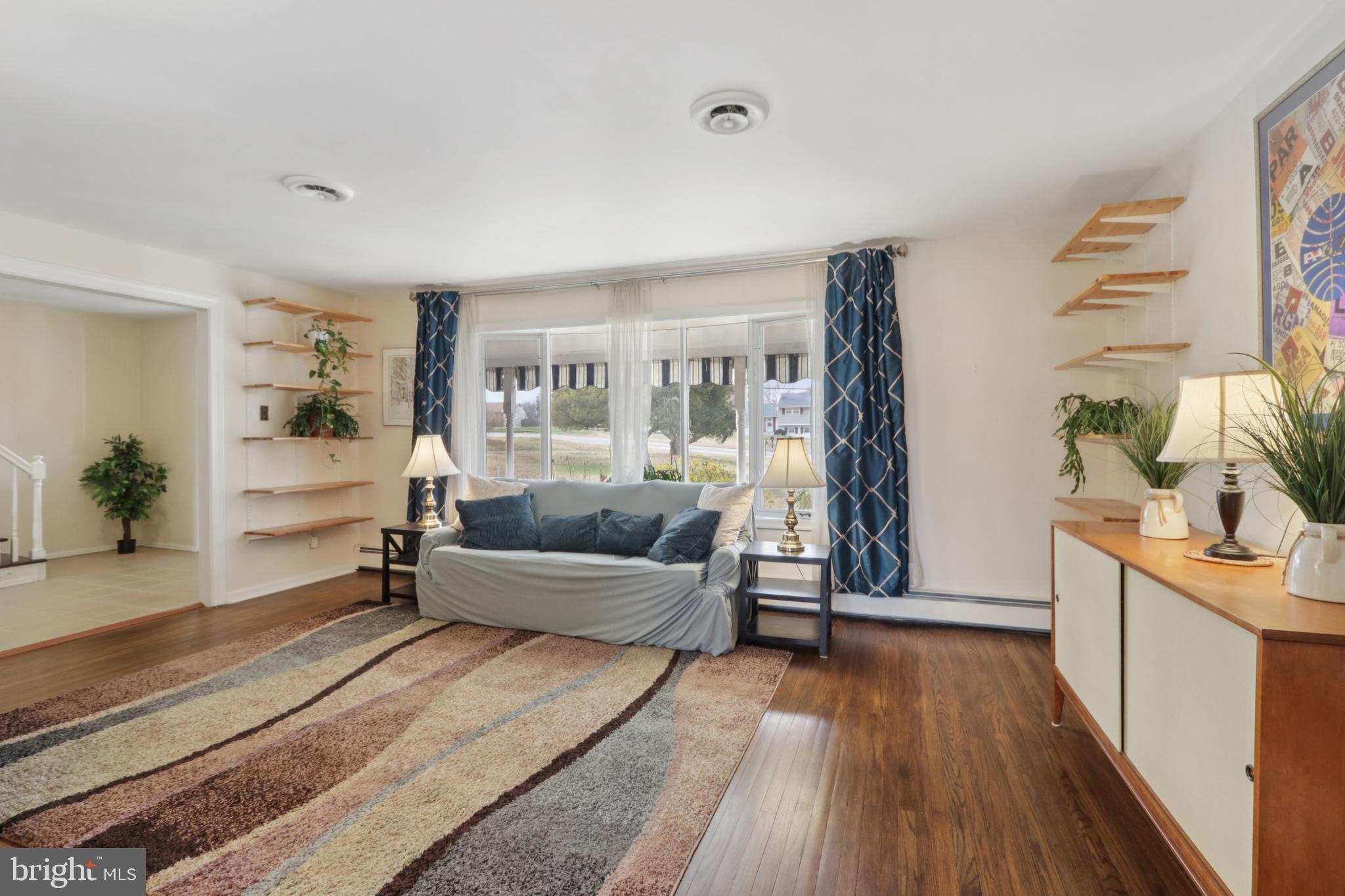 980 Bear Tavern Road Titusville, NJ 08560 - Photo 11 of 66 a living room with furniture and a wooden floor