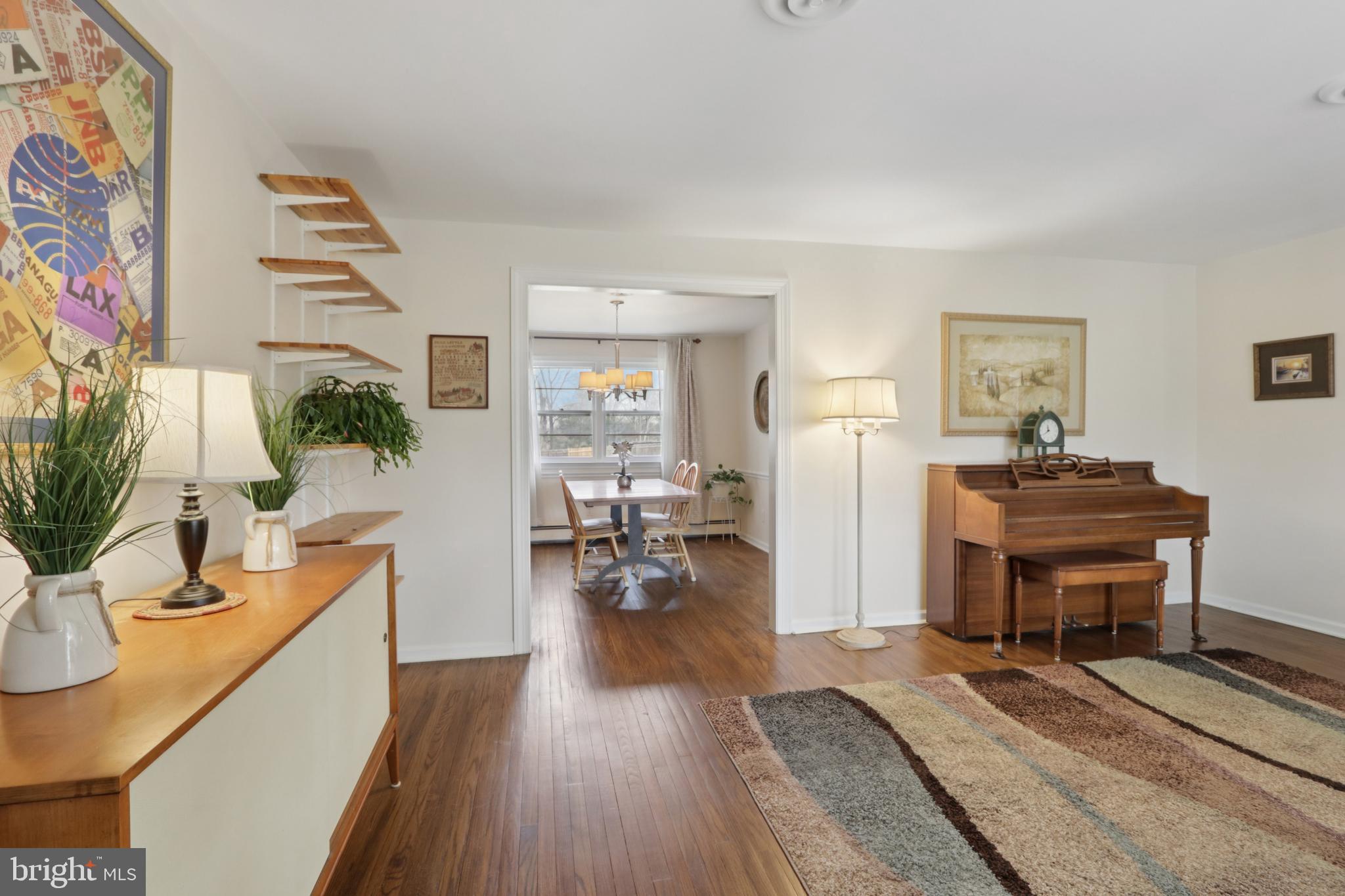 980 Bear Tavern Road Titusville, NJ 08560 - Photo 13 of 66 a living room with furniture and a wooden floor