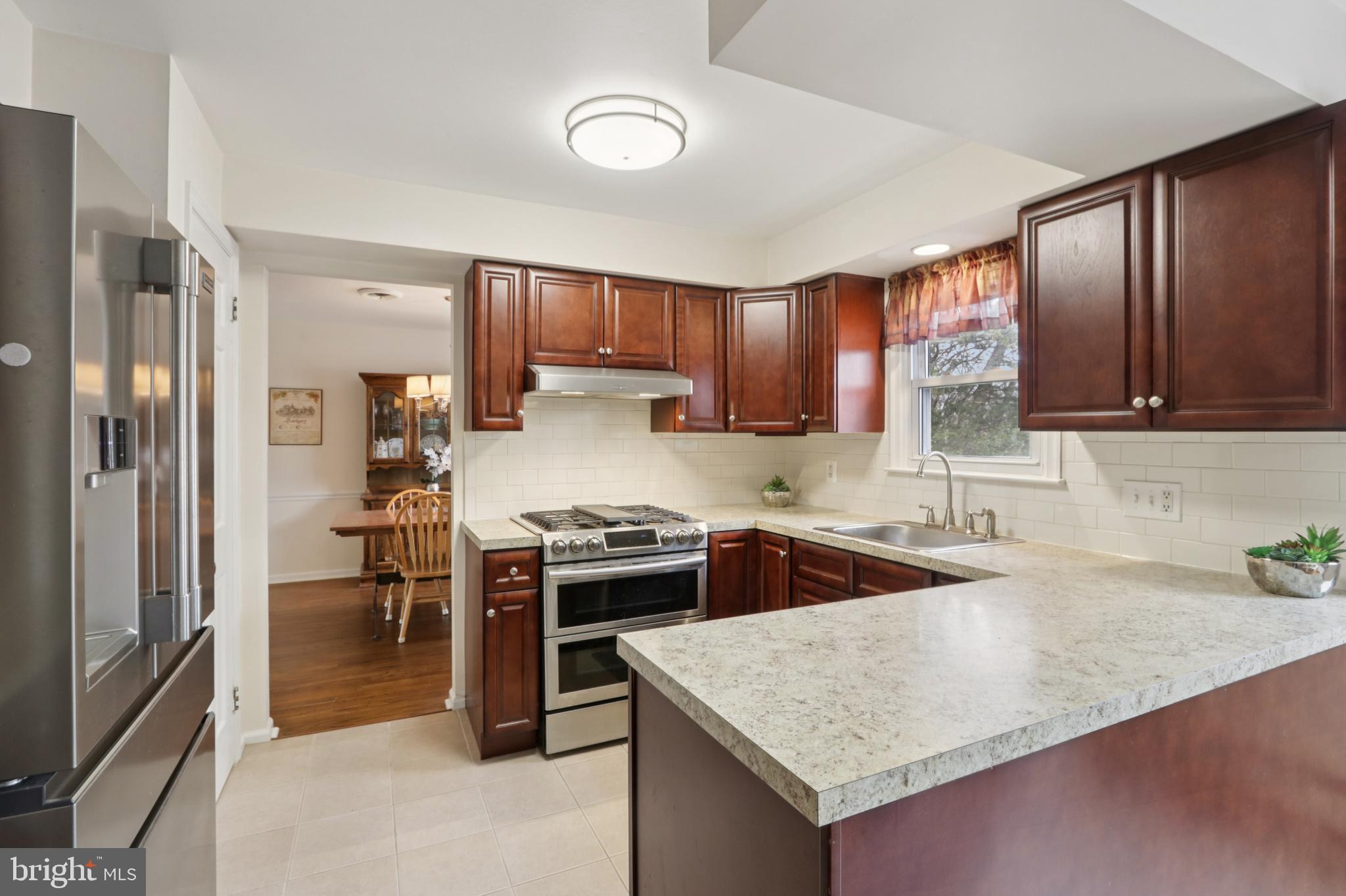 980 Bear Tavern Road Titusville, NJ 08560 - Photo 21 of 66 a kitchen with stainless steel appliances granite countertop a sink stove and refrigerator