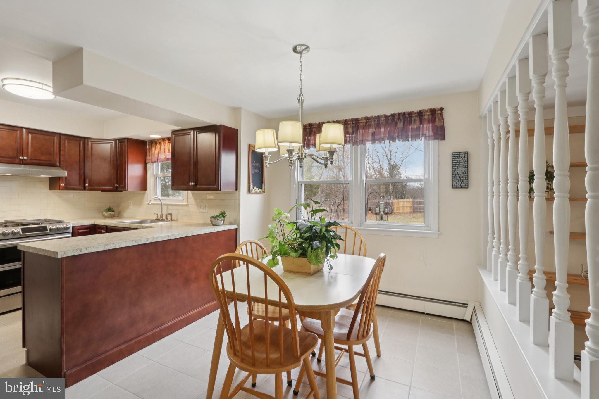 980 Bear Tavern Road Titusville, NJ 08560 - Photo 28 of 66 a living room with stainless steel appliances granite countertop furniture a kitchen island a stove a refrigerator with a dining table and chairs