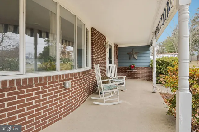 a view of a hallway with paintings on the wall