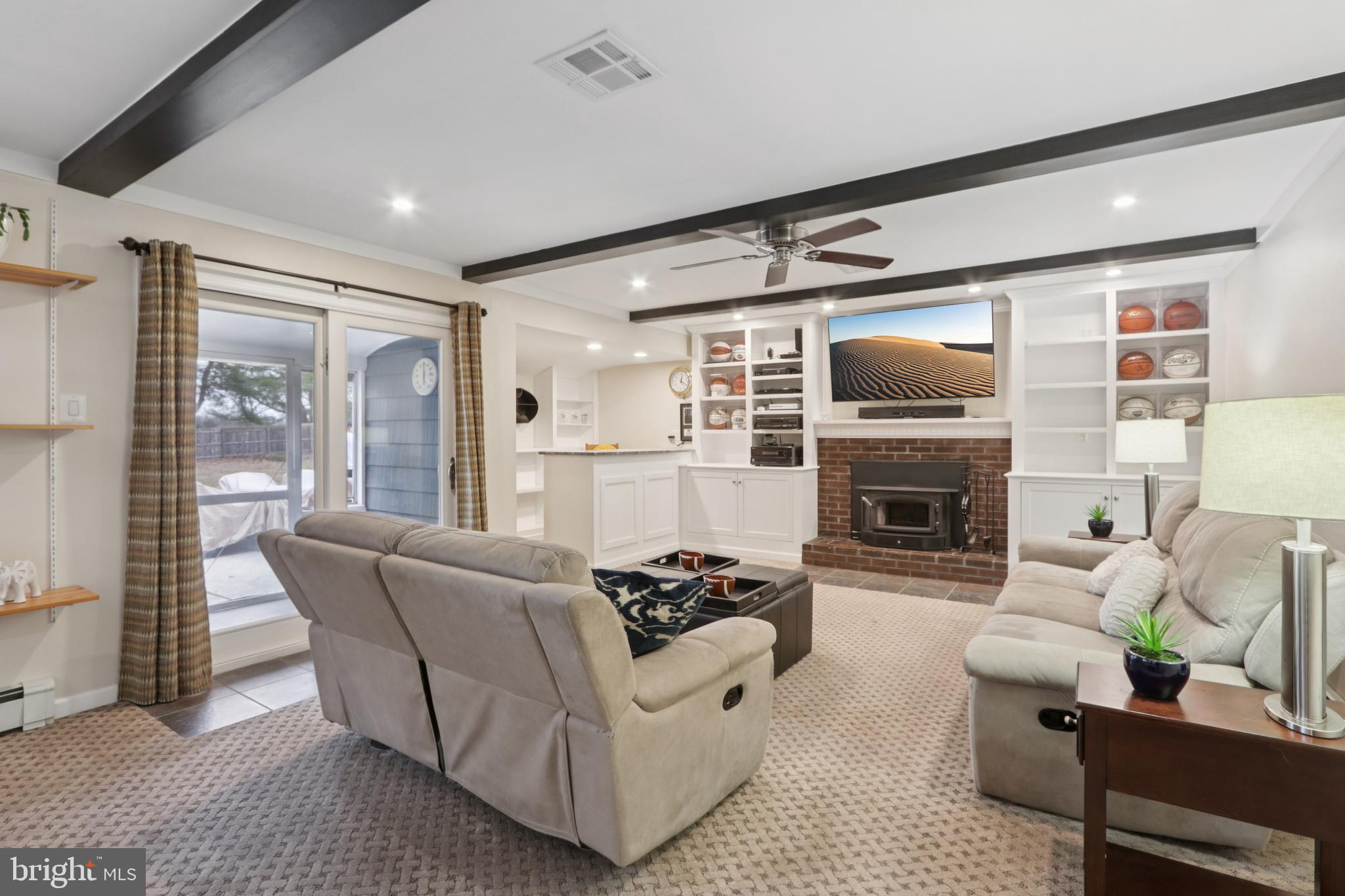 980 Bear Tavern Road Titusville, NJ 08560 - Photo 33 of 66 a living room with furniture a fireplace and a flat screen tv