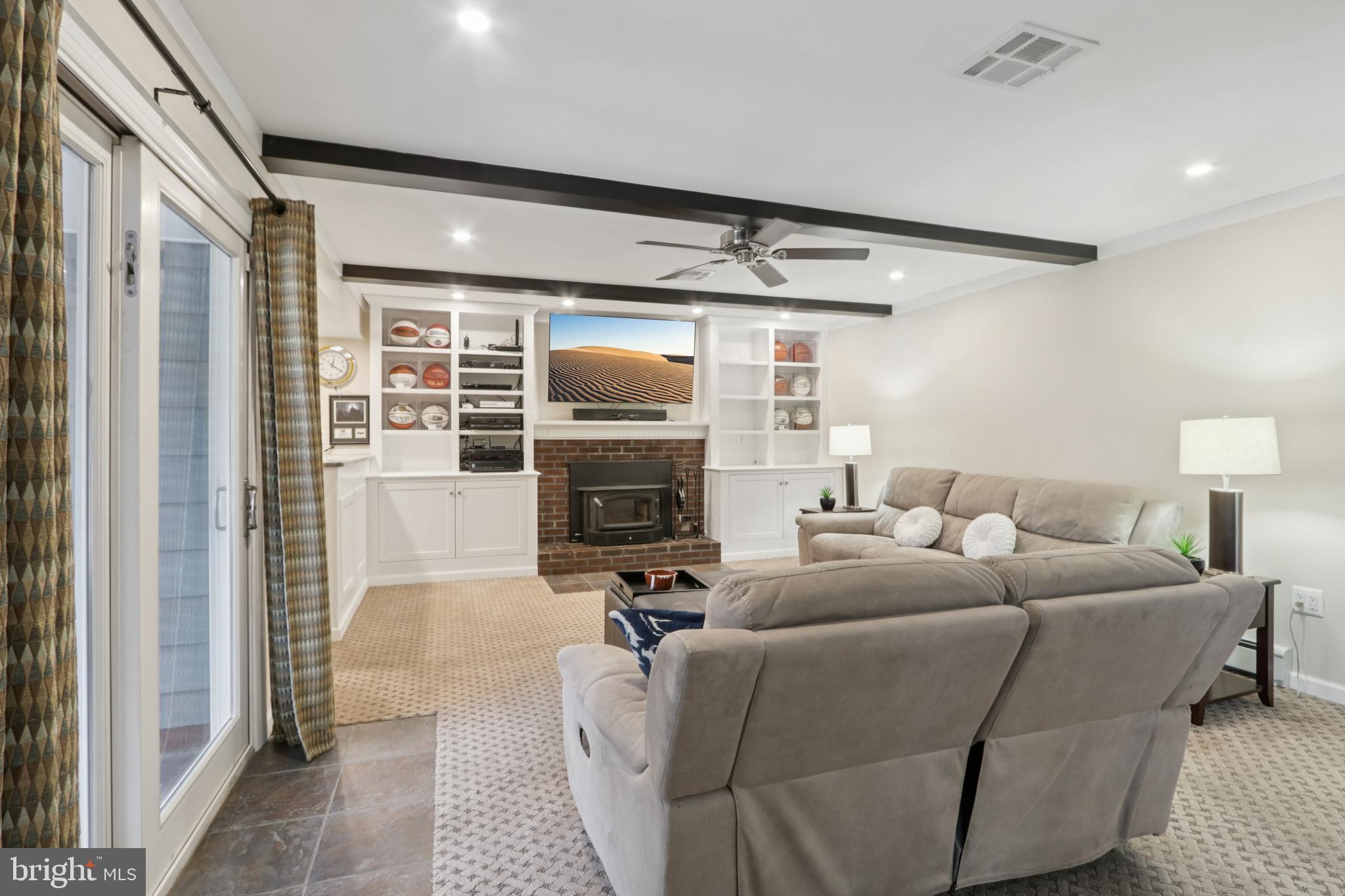 980 Bear Tavern Road Titusville, NJ 08560 - Photo 34 of 66 a living room with furniture a fireplace and a flat screen tv