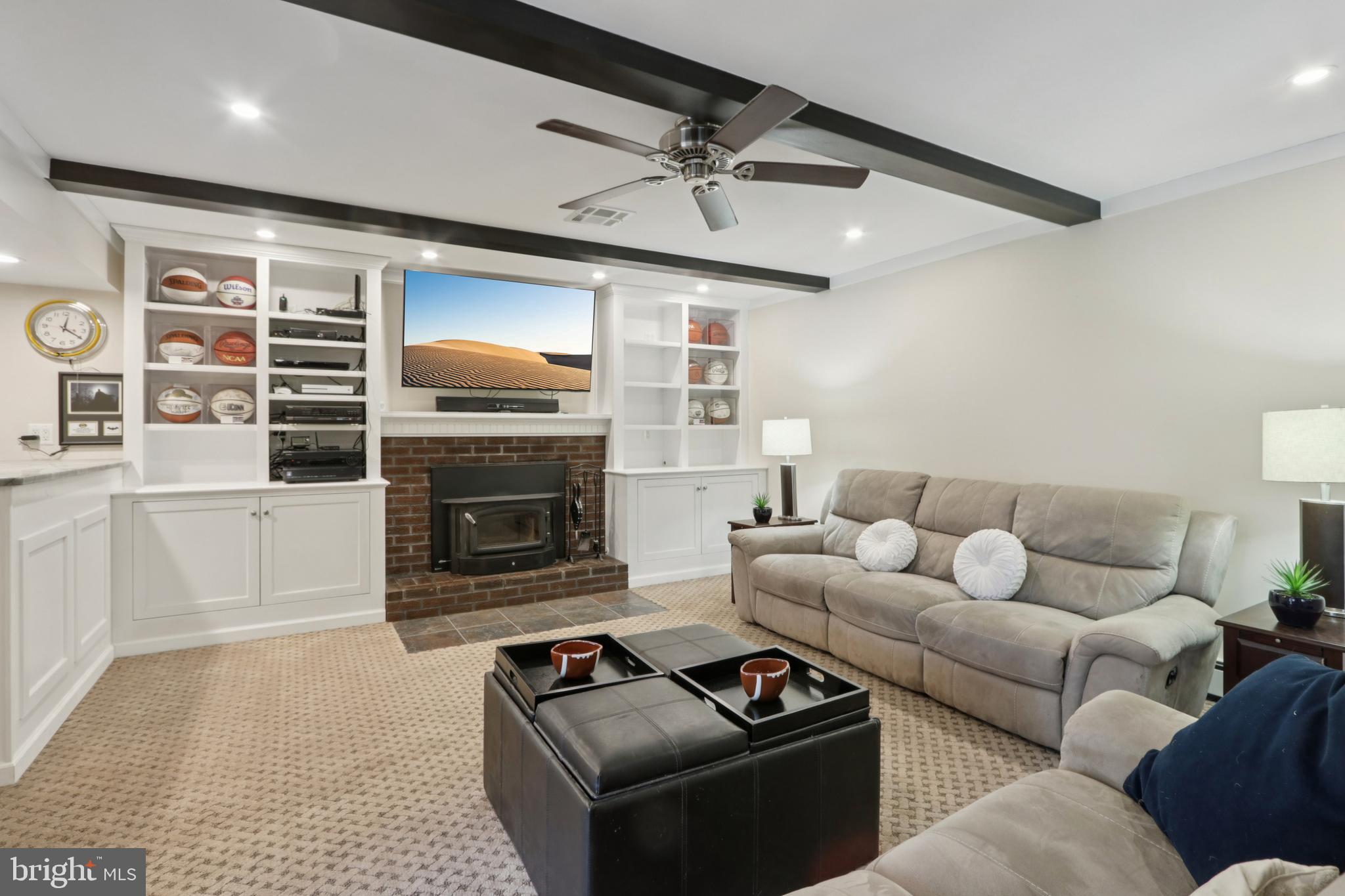 980 Bear Tavern Road Titusville, NJ 08560 - Photo 35 of 66 a living room with furniture a flat screen tv and a fireplace