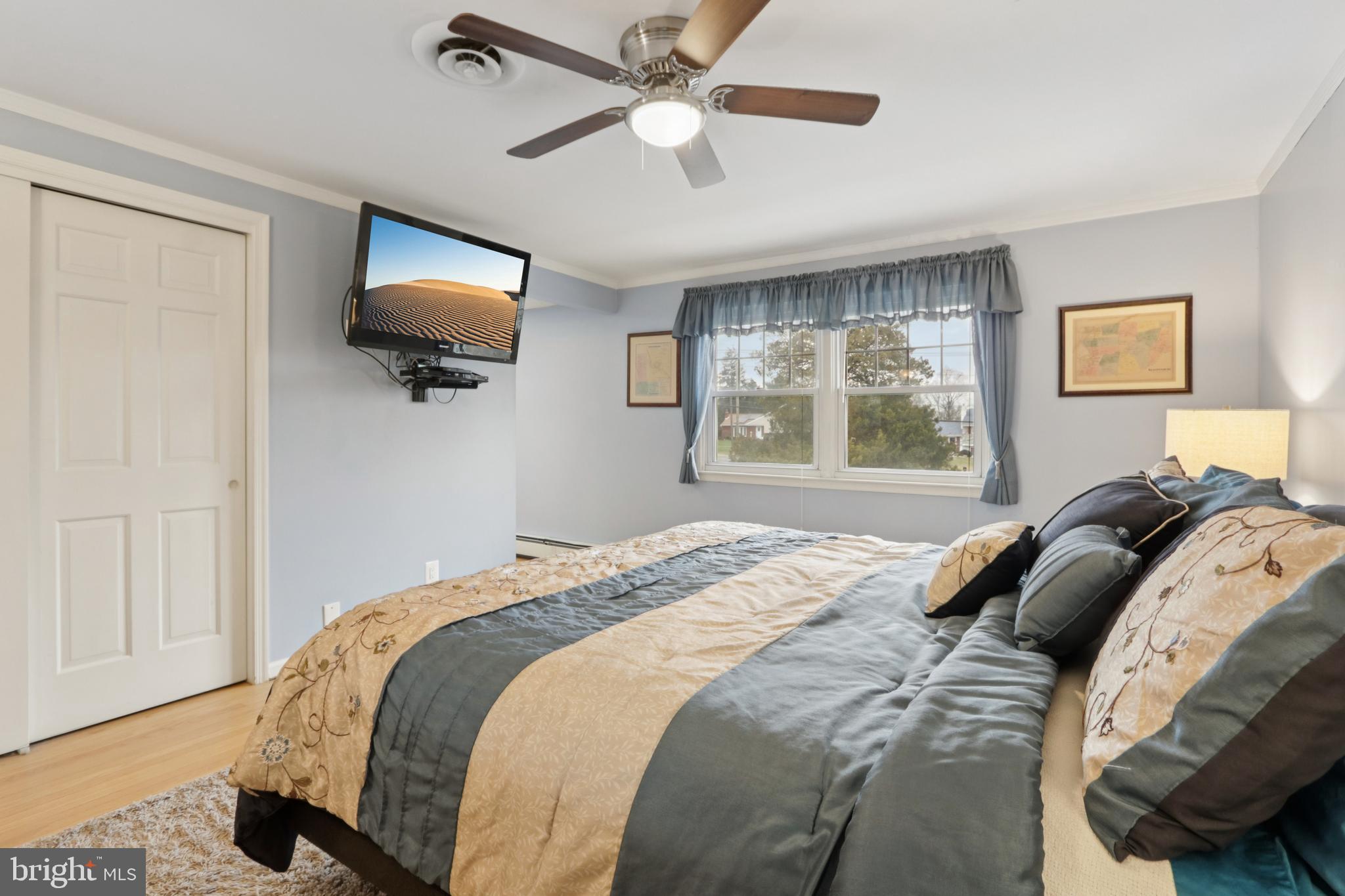 980 Bear Tavern Road Titusville, NJ 08560 - Photo 44 of 66 a bedroom with a bed and a flat screen tv