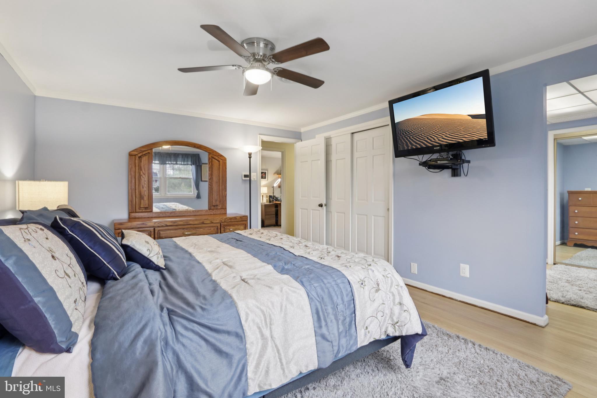 980 Bear Tavern Road Titusville, NJ 08560 - Photo 46 of 66 a bedroom with a large bed and a flat screen tv