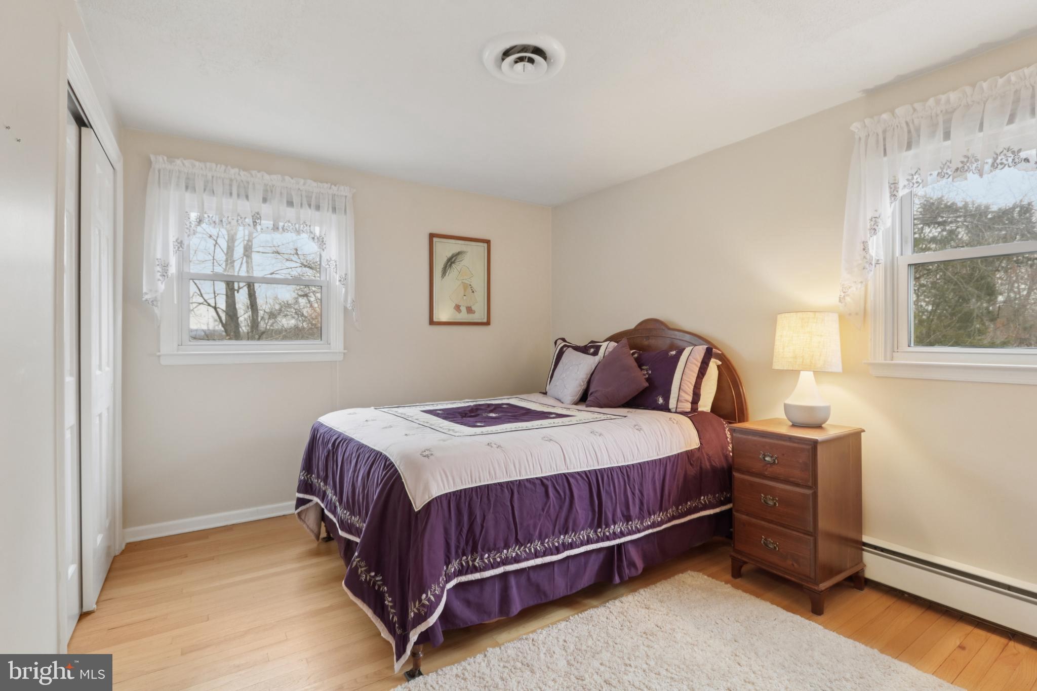 980 Bear Tavern Road Titusville, NJ 08560 - Photo 52 of 66 a bedroom with a bed lamp and a window