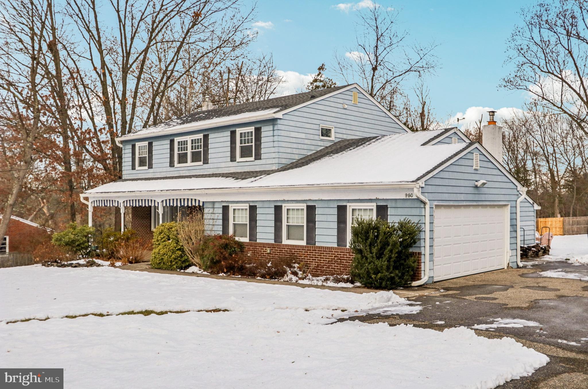 980 Bear Tavern Road Titusville, NJ 08560 - Photo 63 of 66 a front view of a house with a yard and garage