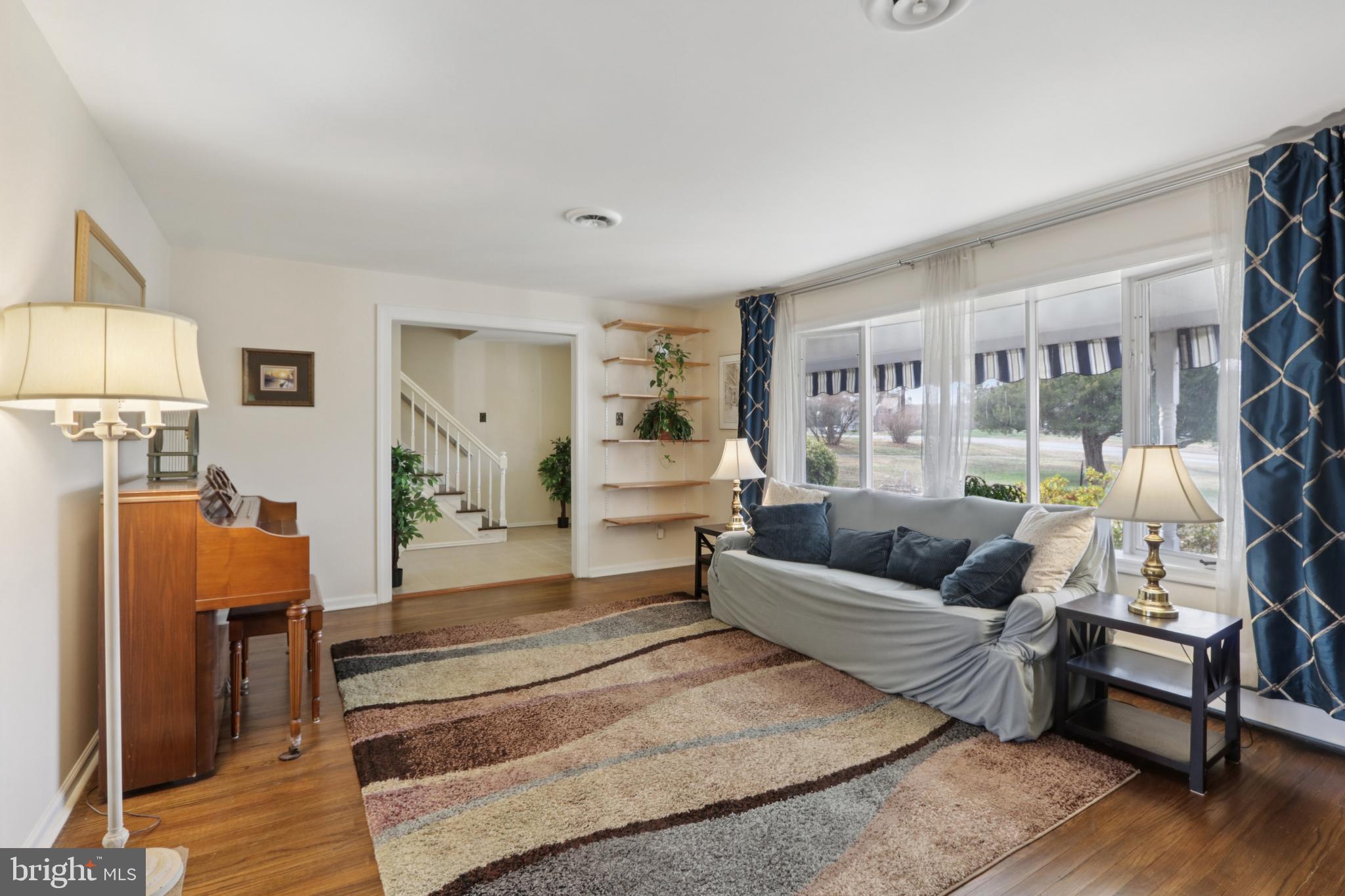 980 Bear Tavern Road Titusville, NJ 08560 - Photo 8 of 66 a living room with furniture and a lamp