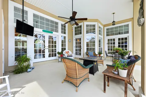a building outdoor space with patio furniture and potted plants