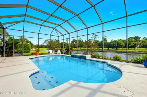 a view of a swimming pool with a porch