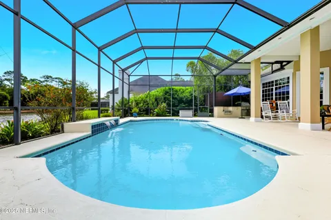 a view of a swimming pool with a patio