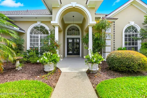 a front view of a house with garden