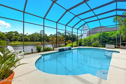 a view of a swimming pool with a patio