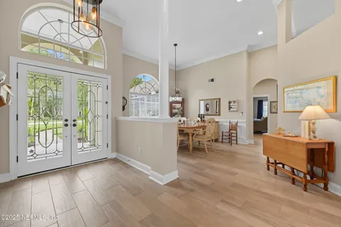 a view of a livingroom with furniture window and wooden floor