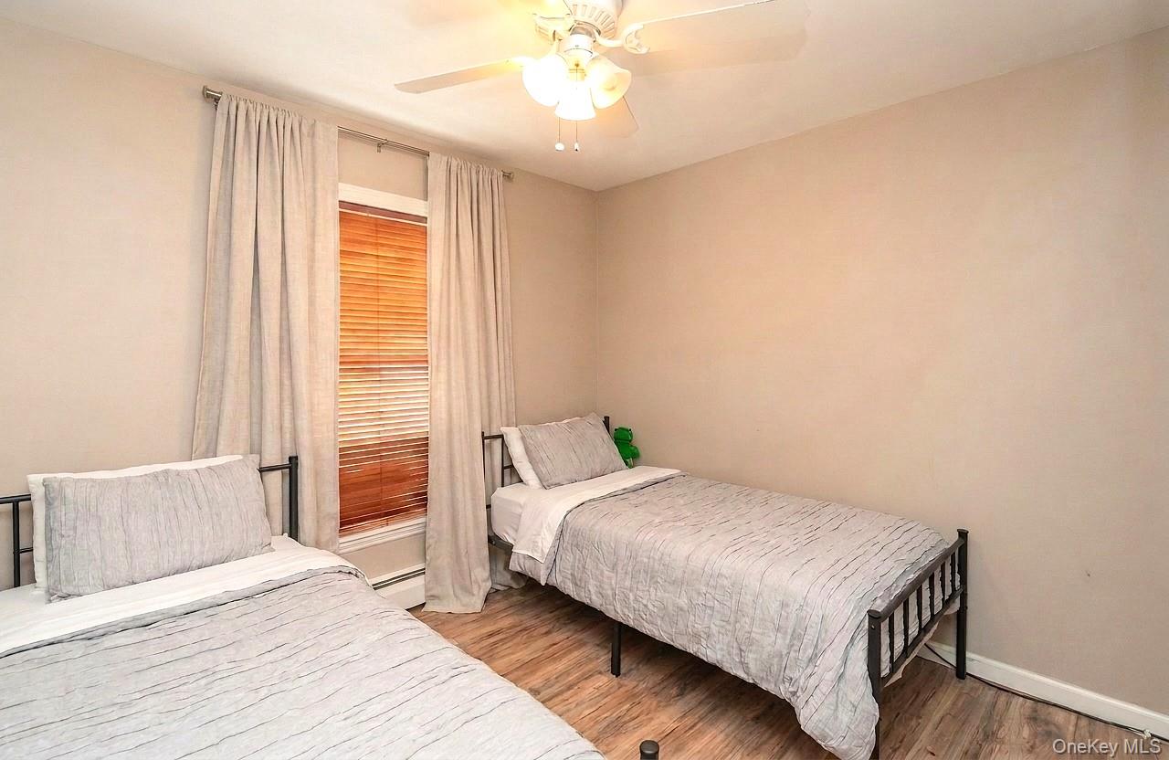 29 Murray Road Middletown, NY 10940 - Photo 10 of 24 a bedroom with a bed and a chandelier