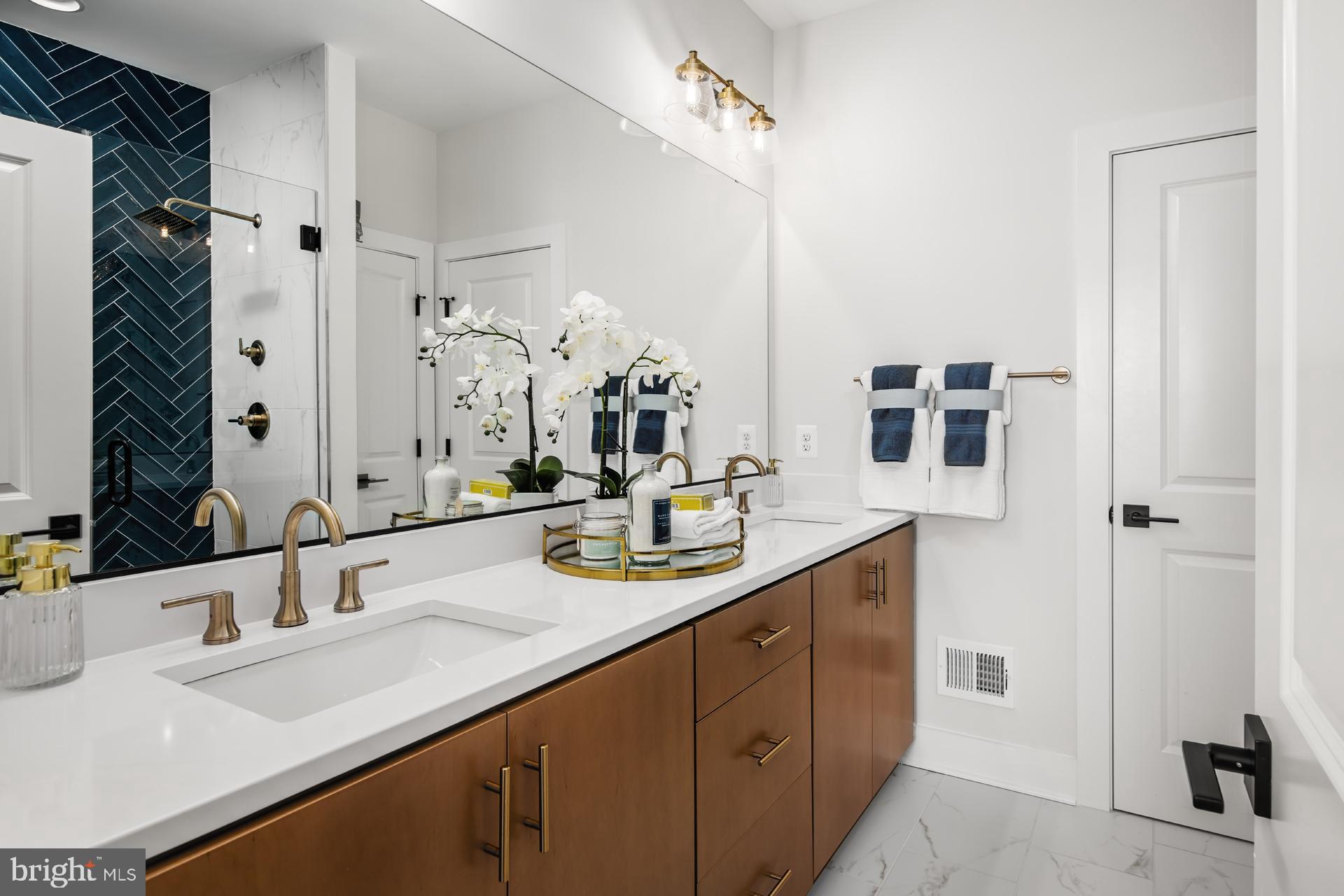 279 Light Street Baltimore, MD 21230 - Photo 17 of 29 a bathroom with a sink double vanity granite and a mirror