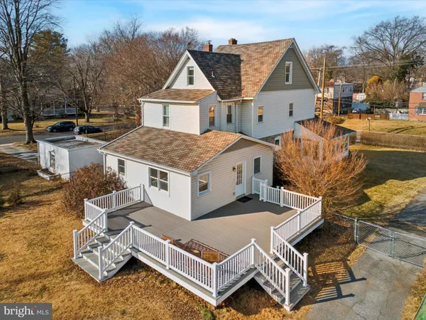 a aerial view of a house with swimming pool and sitting area