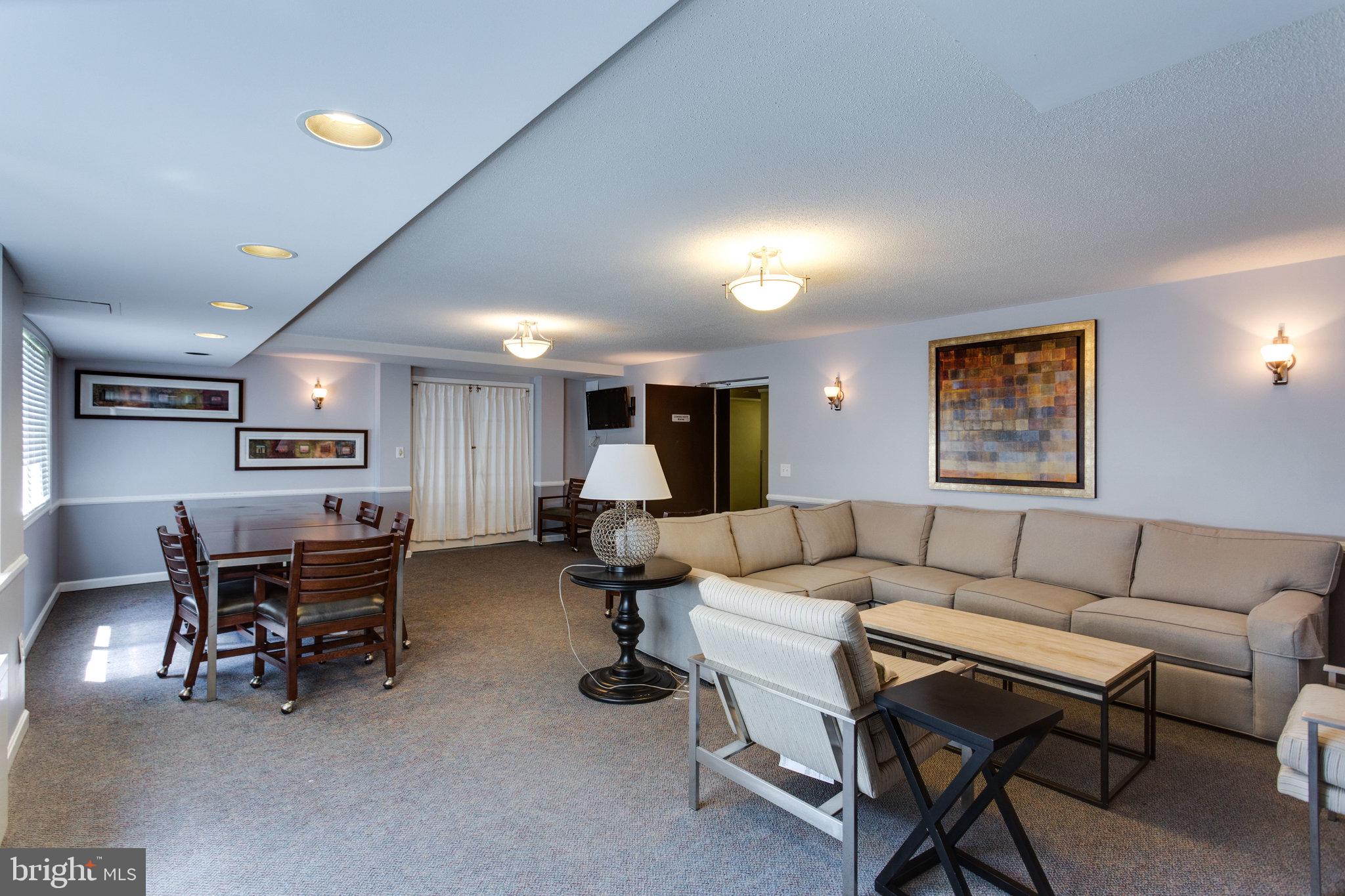 3515 Washington Boulevard, Unit 415 Arlington, VA 22201 - Photo 13 of 60 a living room with furniture a desk and chair