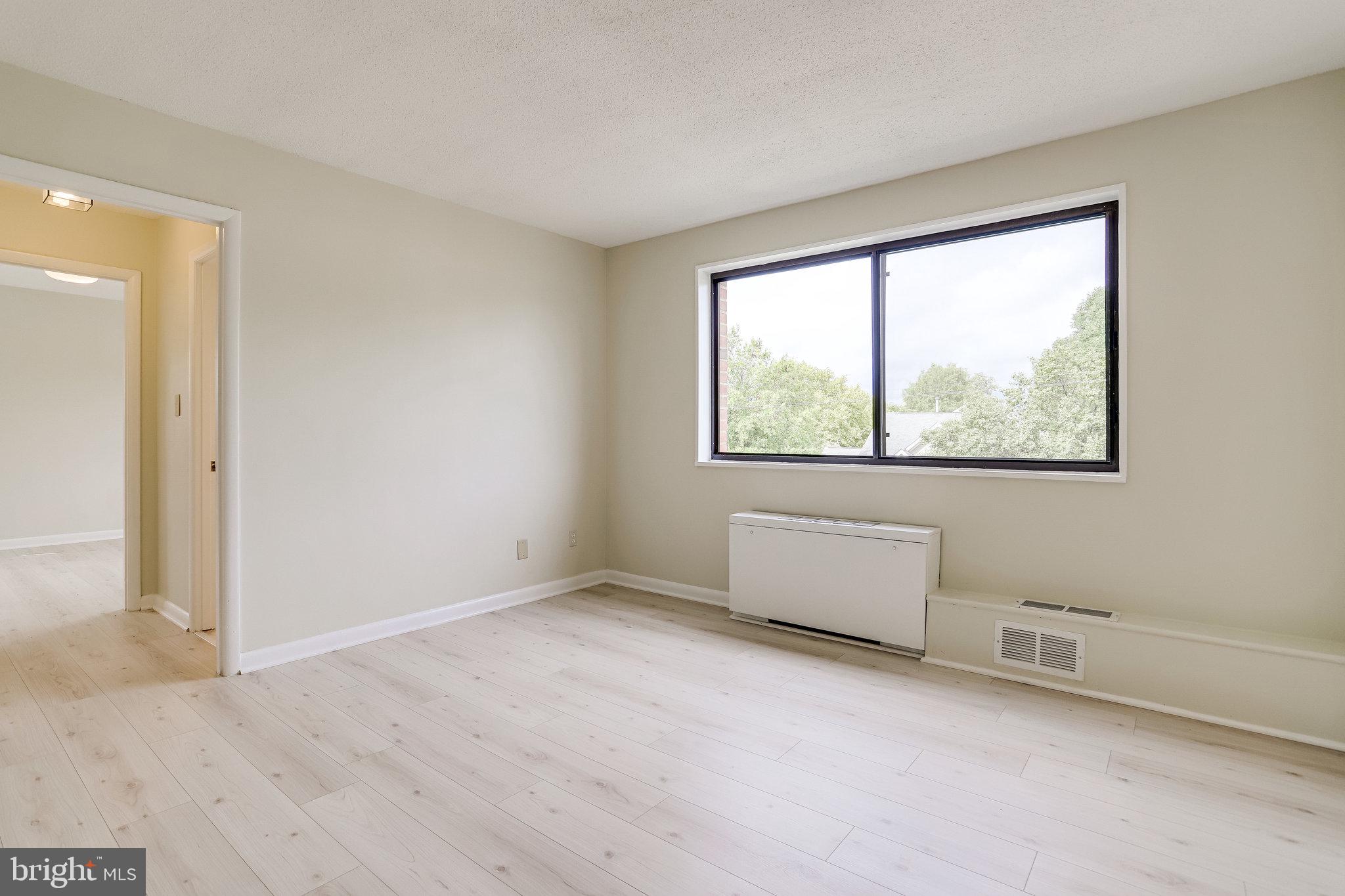 3515 Washington Boulevard, Unit 415 Arlington, VA 22201 - Photo 22 of 60 an empty room with windows