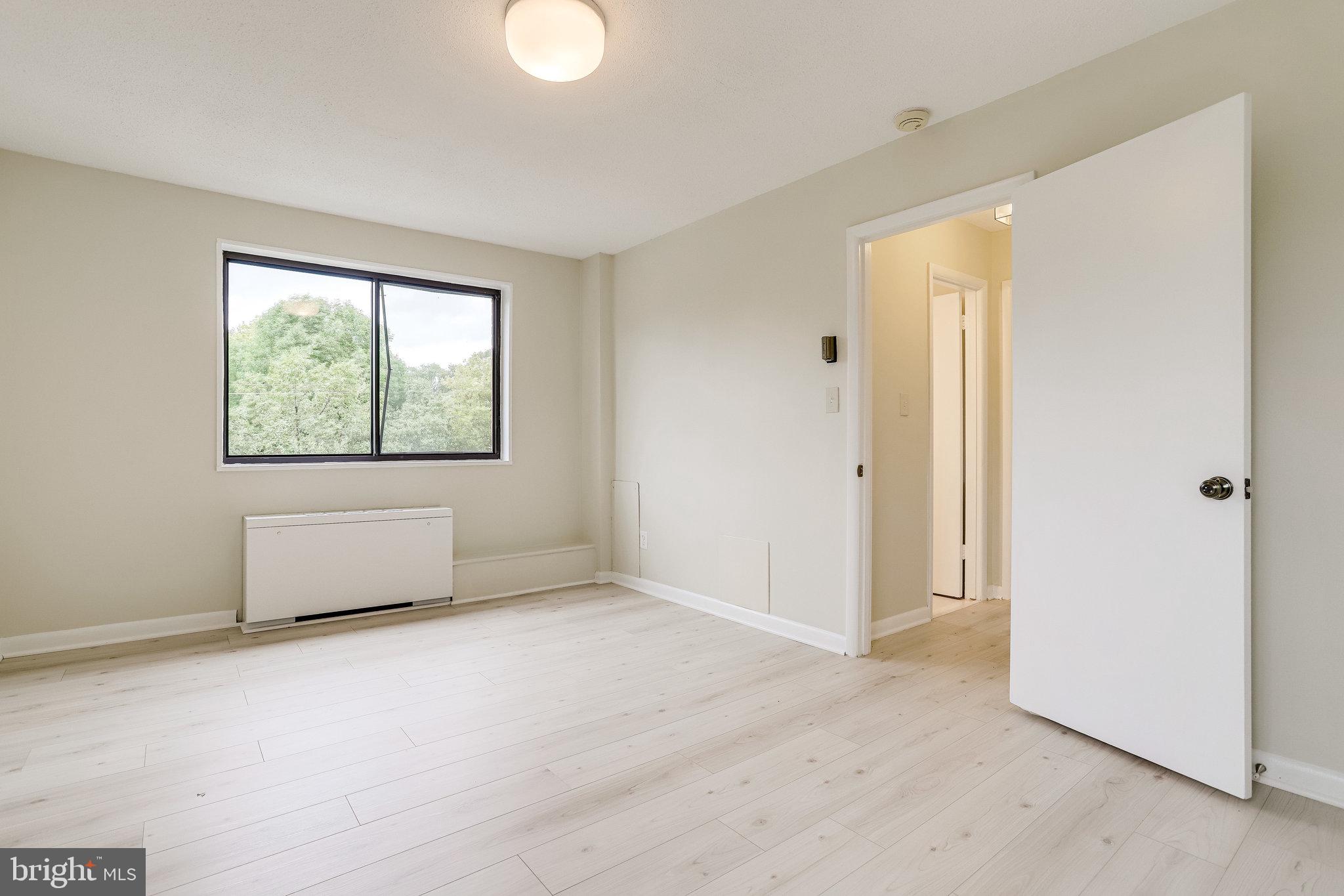 3515 Washington Boulevard, Unit 415 Arlington, VA 22201 - Photo 47 of 60 an empty room with windows and closet