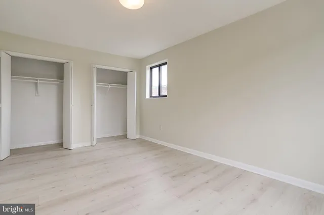 a room with a sink and cabinets