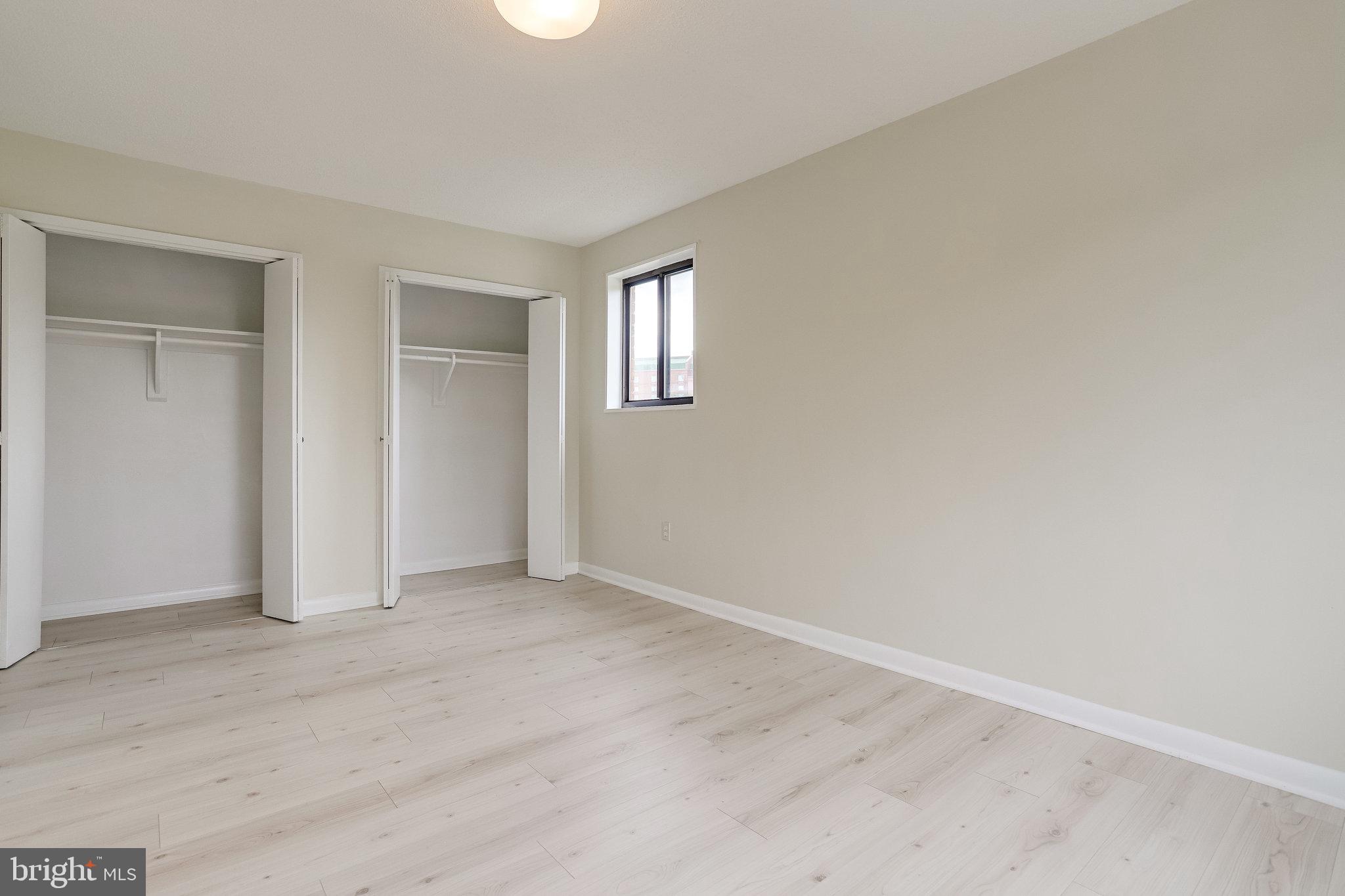 3515 Washington Boulevard, Unit 415 Arlington, VA 22201 - Photo 48 of 60 an empty room with windows