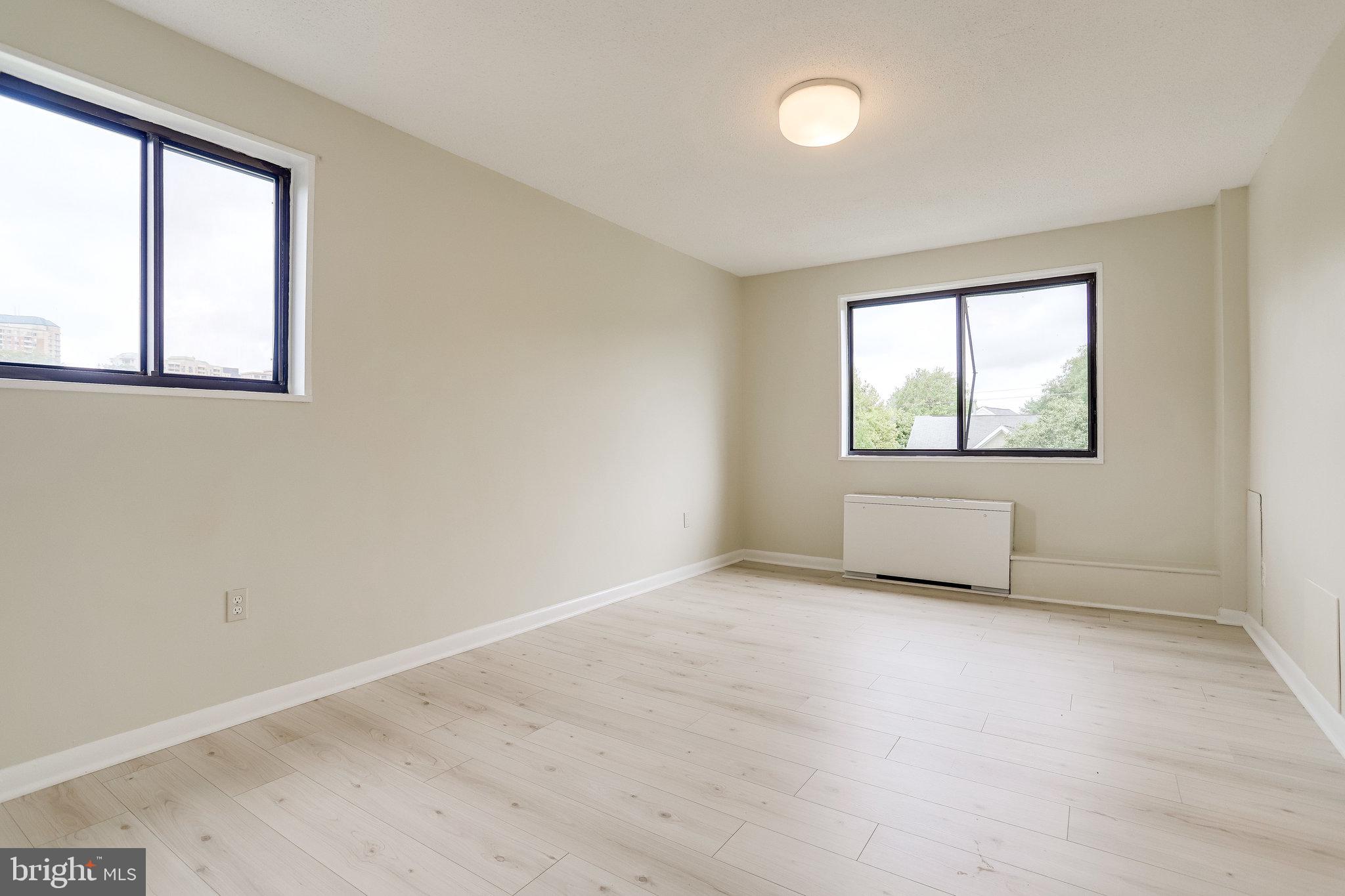 3515 Washington Boulevard, Unit 415 Arlington, VA 22201 - Photo 51 of 60 an empty room with windows