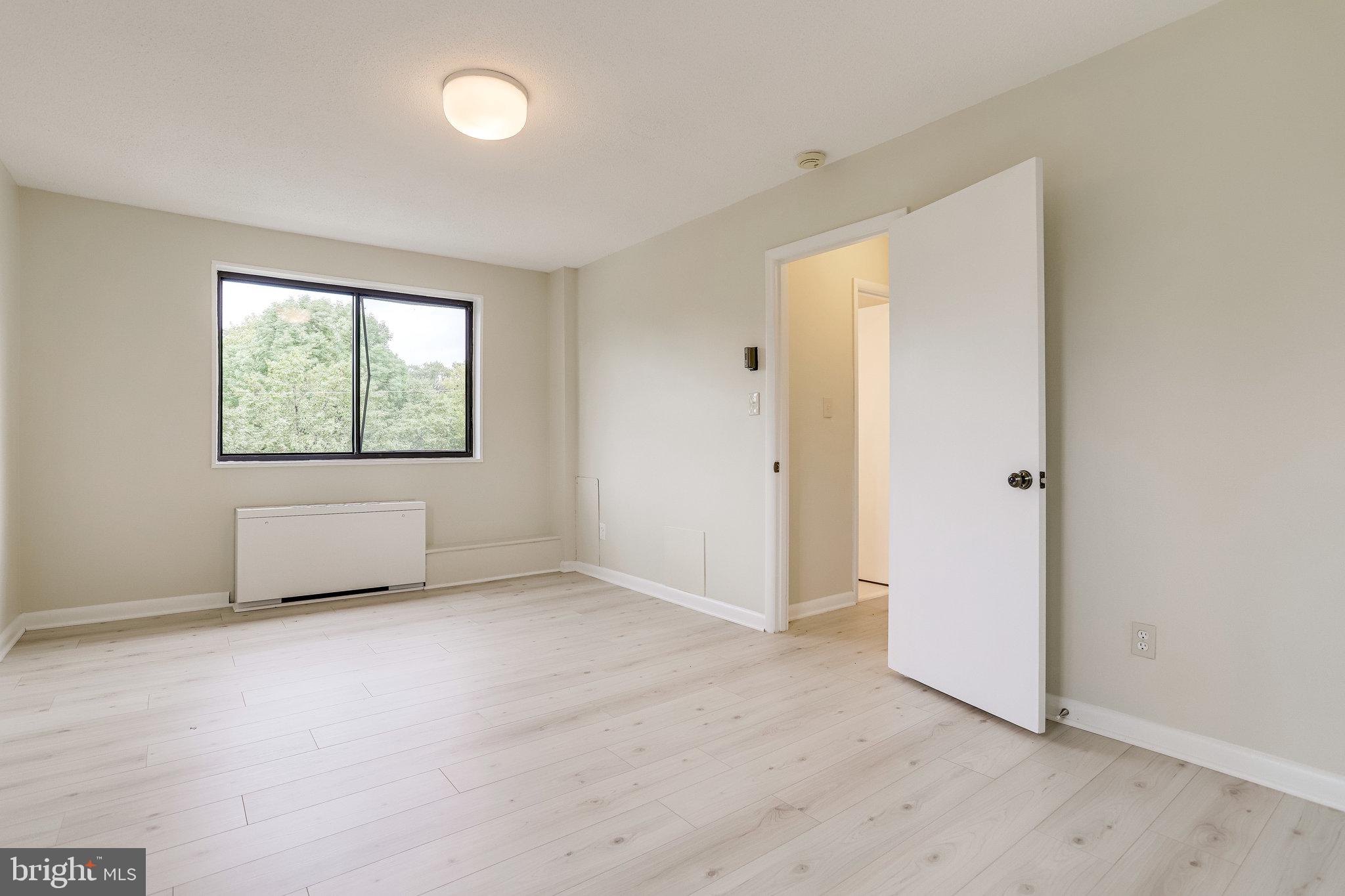3515 Washington Boulevard, Unit 415 Arlington, VA 22201 - Photo 53 of 60 an empty room with windows and closet
