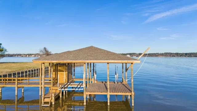 a view of a patio with couches under an umbrella