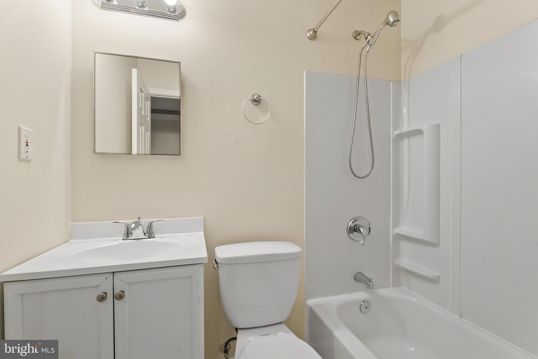 1709 Woodruff Way Frederick, MD 21701 - Photo 23 of 42 a bathroom with a sink a toilet and shower