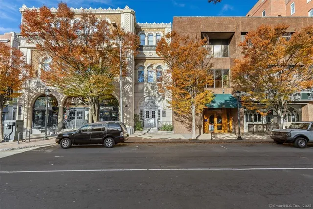 a view of a street with cars