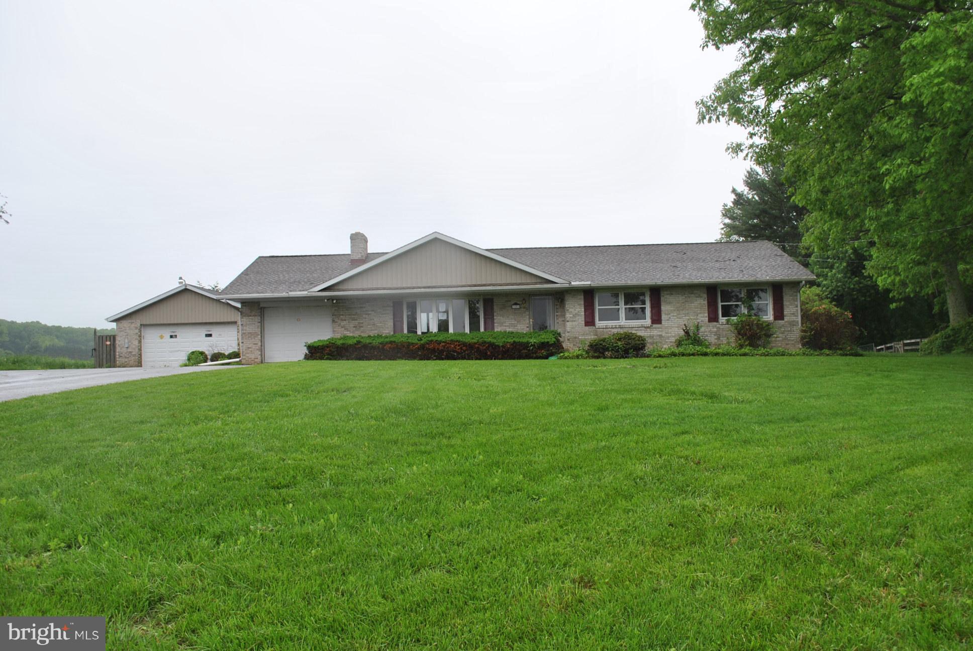 3803 Rockdale Road Manchester, MD 21102 - Photo 1 of 30 a front view of a house with a yard