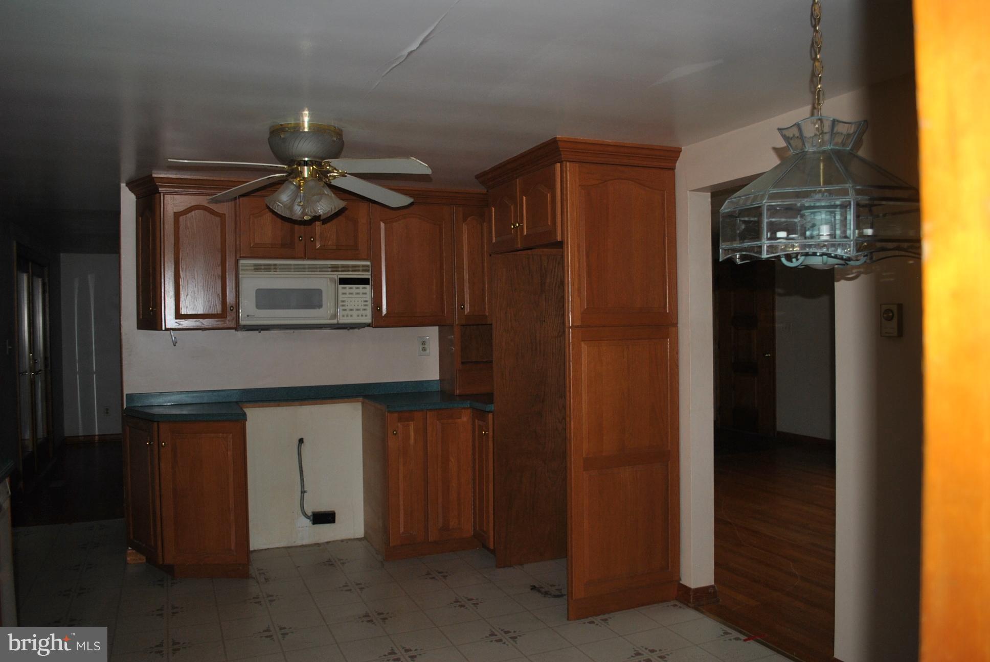 3803 Rockdale Road Manchester, MD 21102 - Photo 12 of 30 a kitchen with a refrigerator and a stove