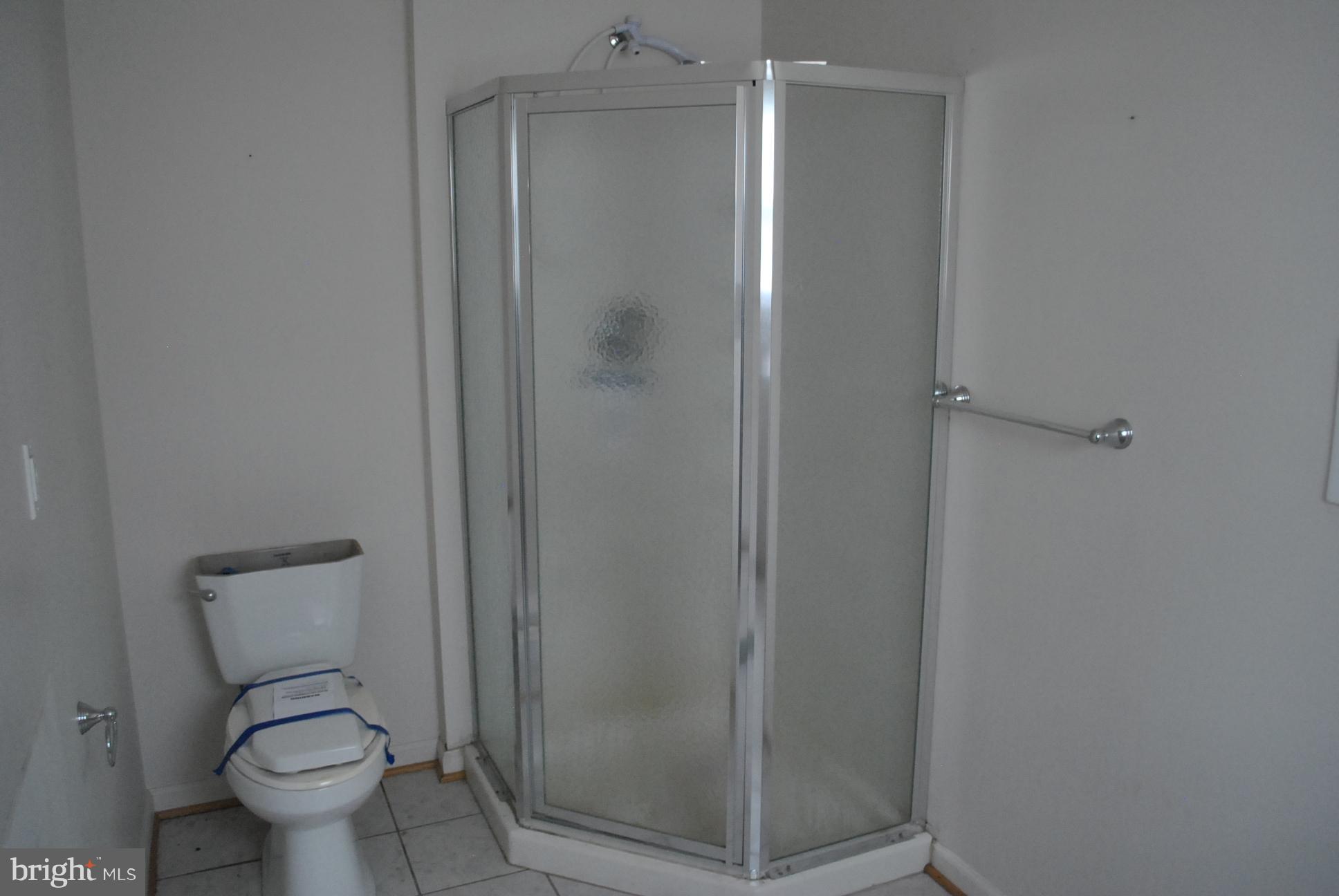 3803 Rockdale Road Manchester, MD 21102 - Photo 28 of 30 a bathroom with a toilet and a shower