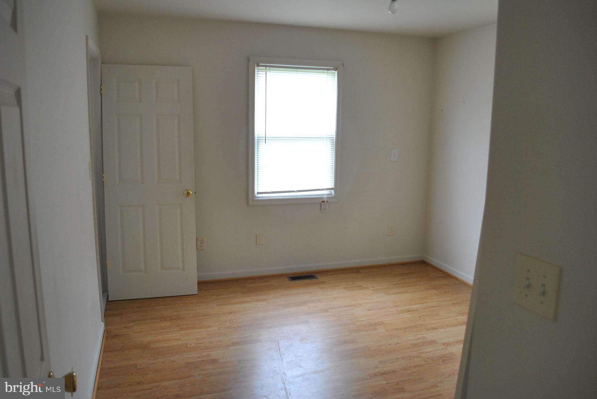 3803 Rockdale Road Manchester, MD 21102 - Photo 29 of 30 an empty room with wooden floor and windows