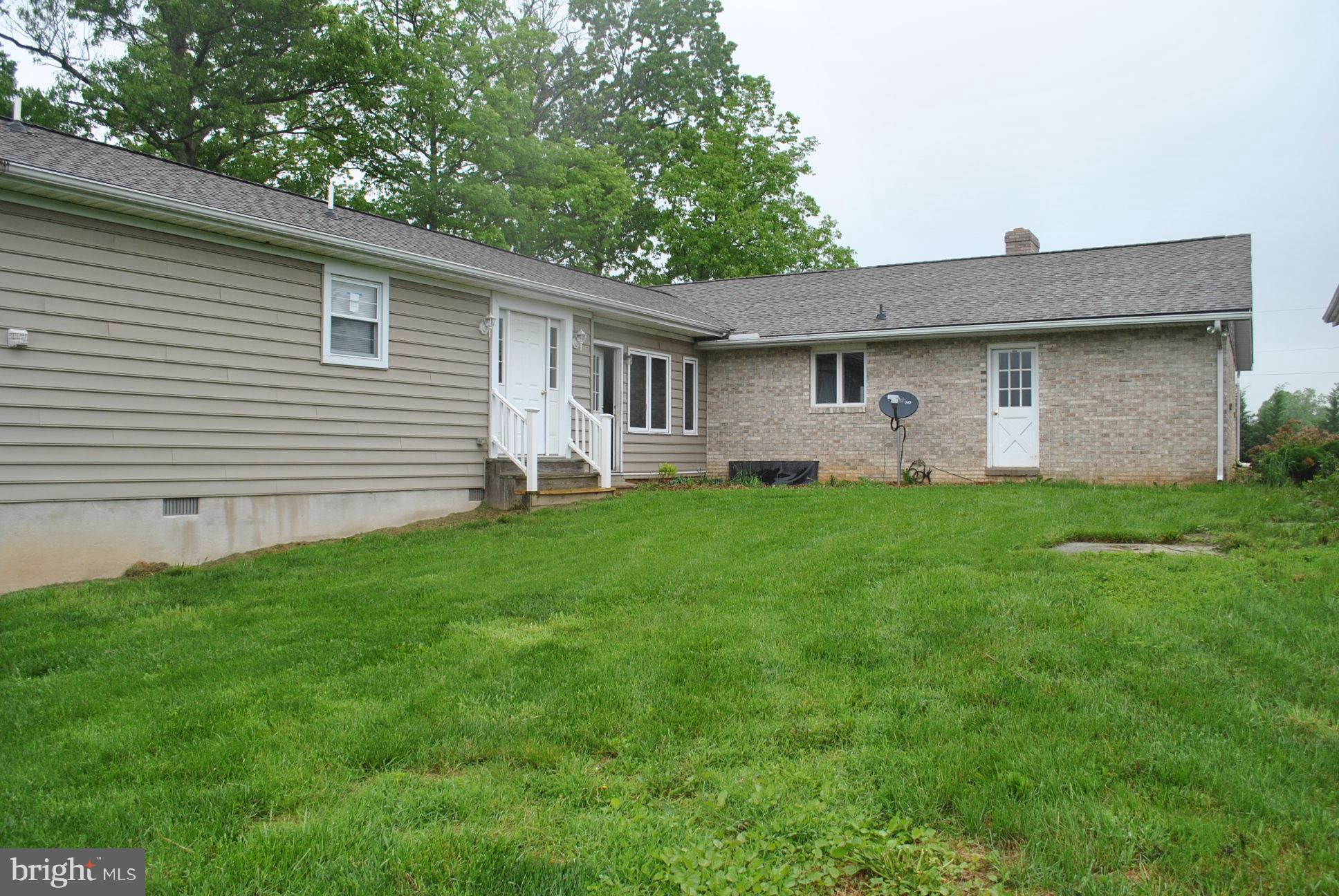 3803 Rockdale Road Manchester, MD 21102 - Photo 4 of 30 a front view of house with yard and green space