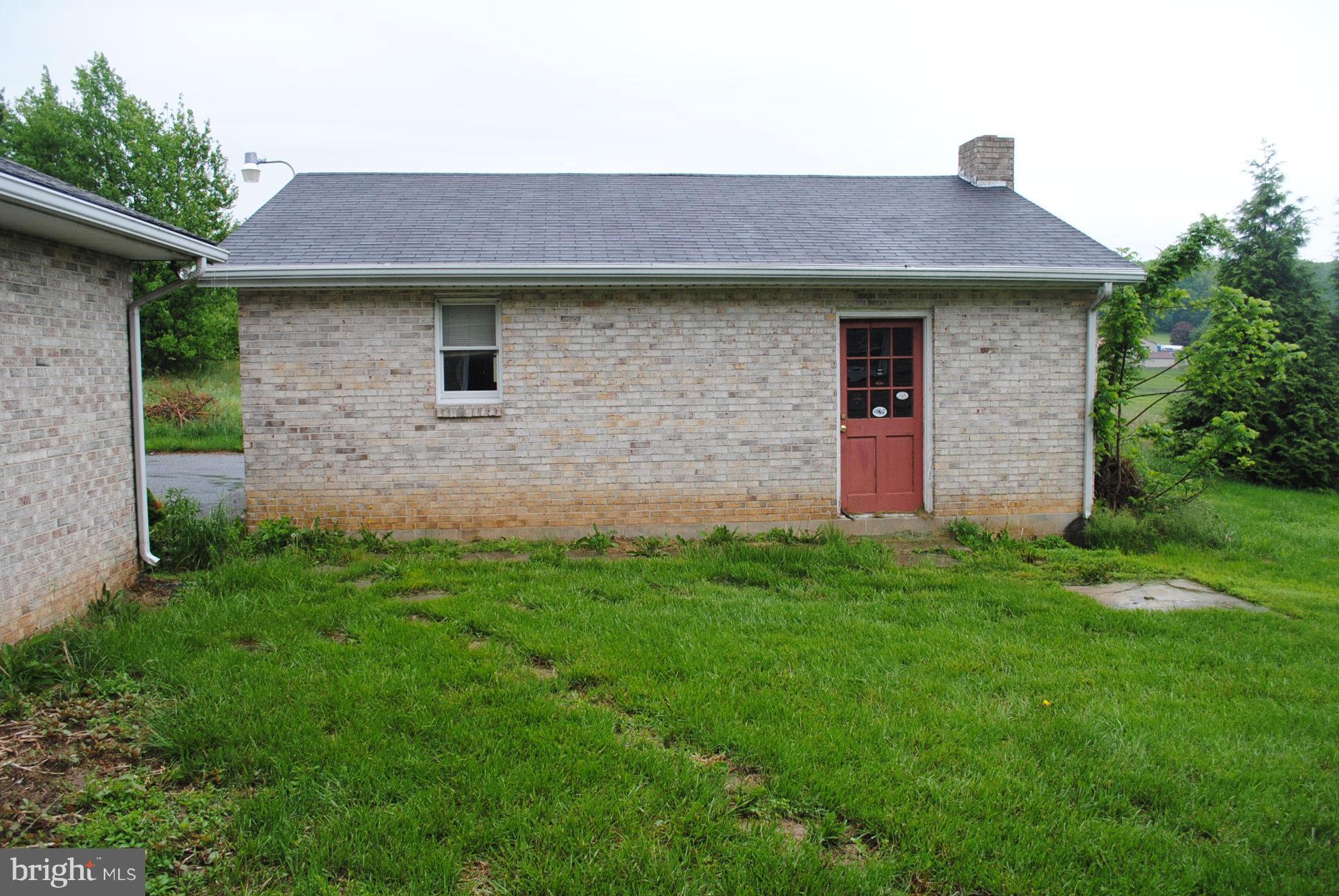 3803 Rockdale Road Manchester, MD 21102 - Photo 6 of 30 a front view of a house with a garden