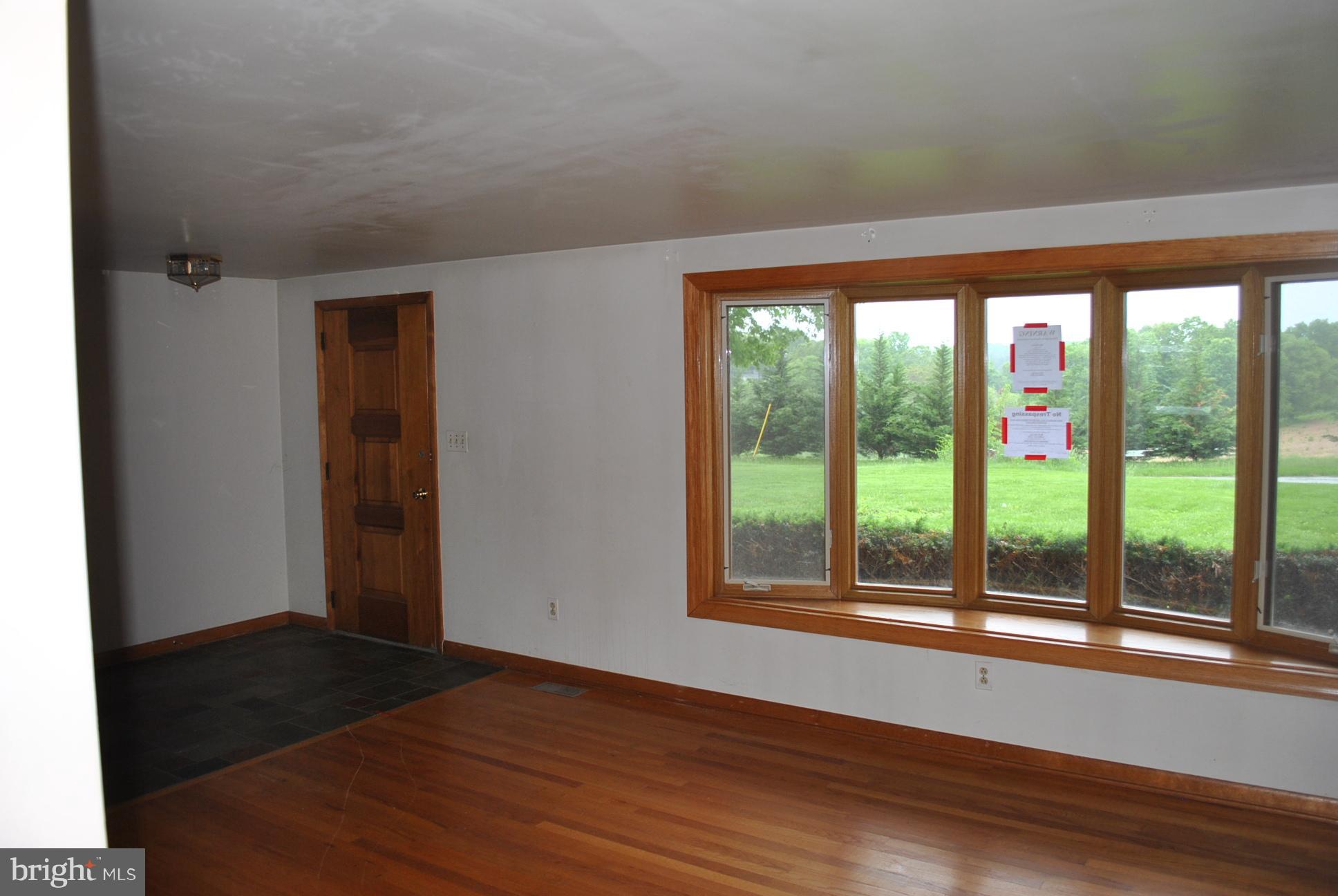 3803 Rockdale Road Manchester, MD 21102 - Photo 8 of 30 a view of empty room with wooden floor and fan