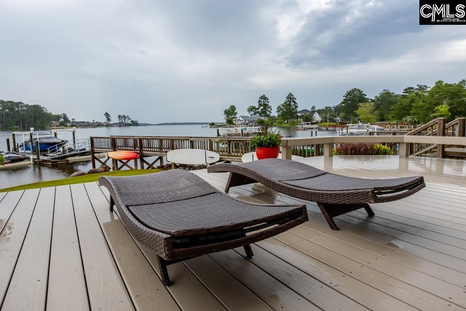357 Cabana Way Lexington, SC 29072 - Photo 17 of 25 a terrace with outdoor seating and trees in the background