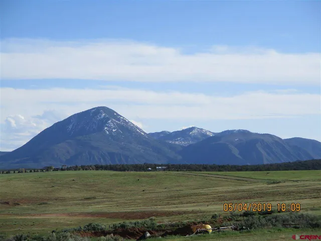 a view of an ocean and mountain